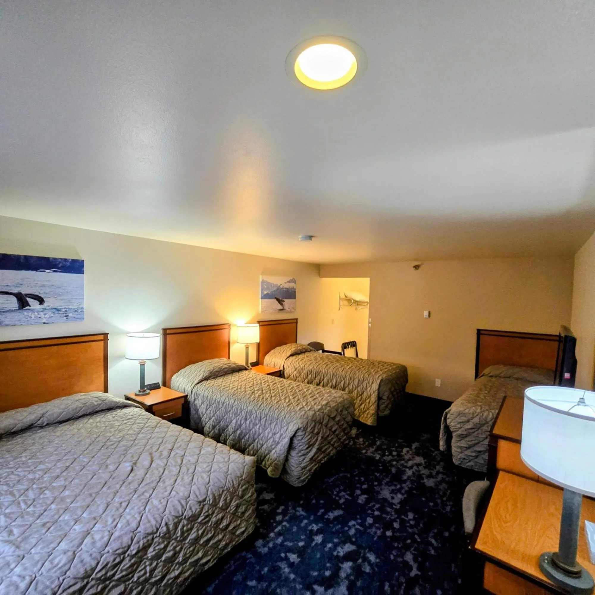 Family Room One Queen & Three Twins in Breeze Inn Hotel & Motel