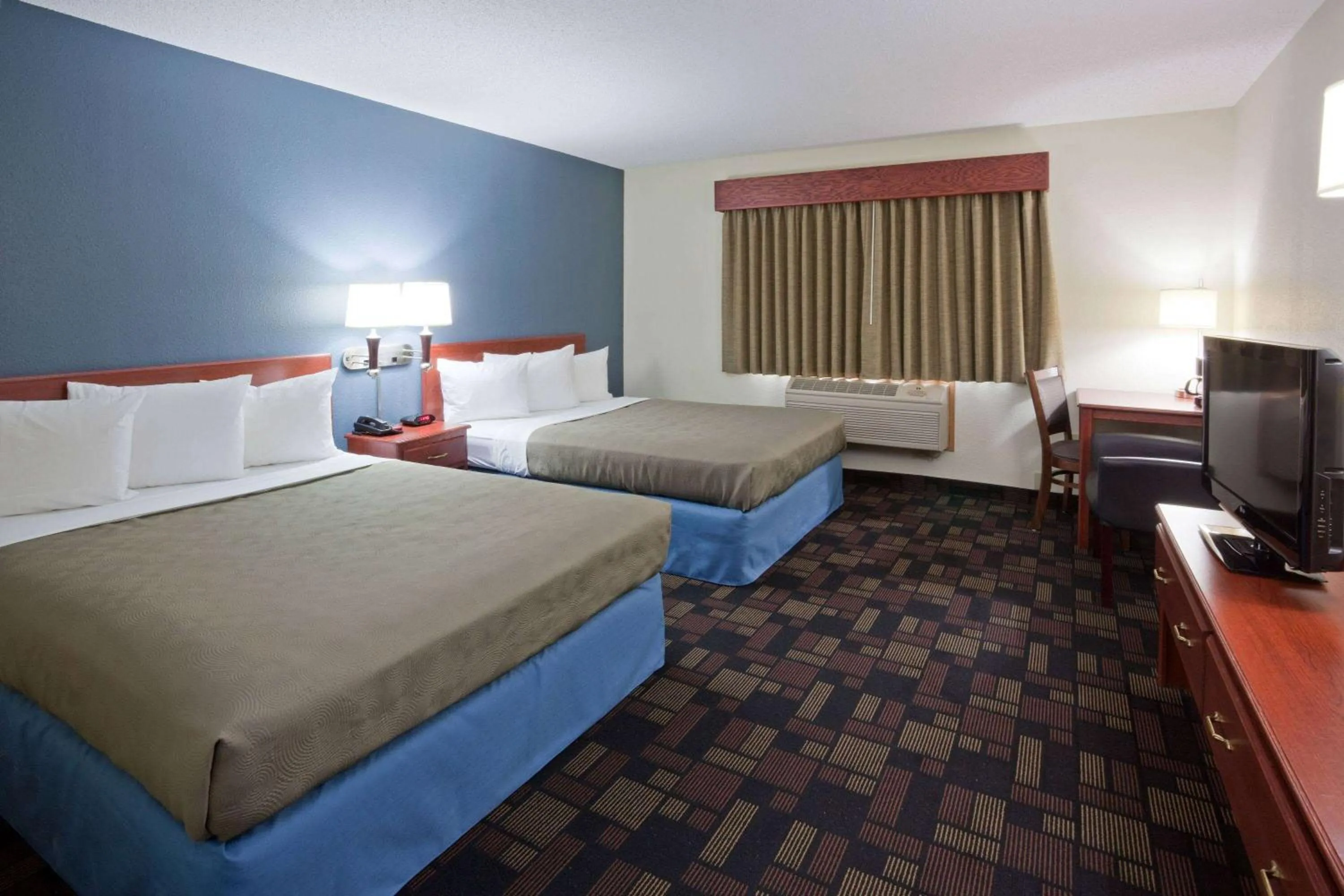 Queen Room with Two Queen Beds - Non-Smoking in AmericInn by Wyndham Austin