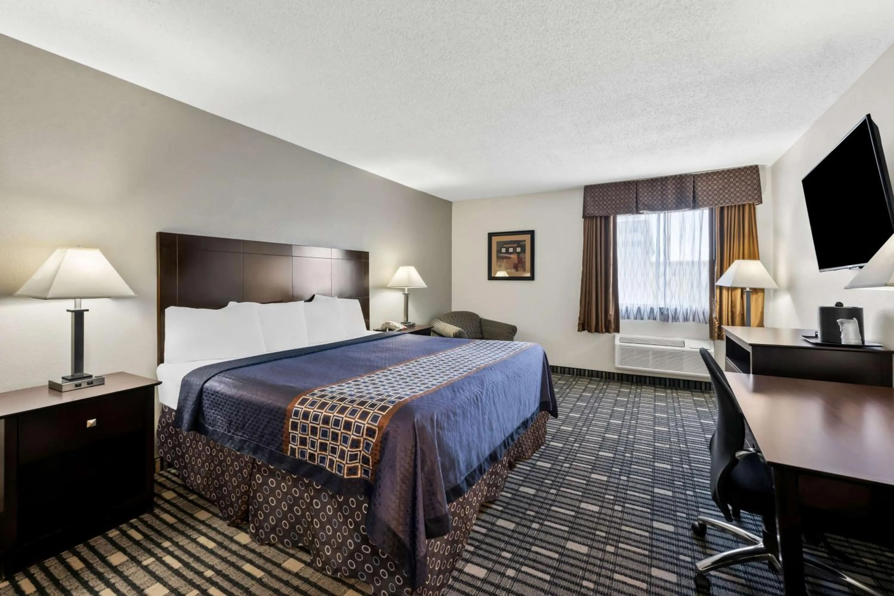 Queen Room with Kitchenette in SureStay Plus Hotel by Best Western Lubbock Medical Center