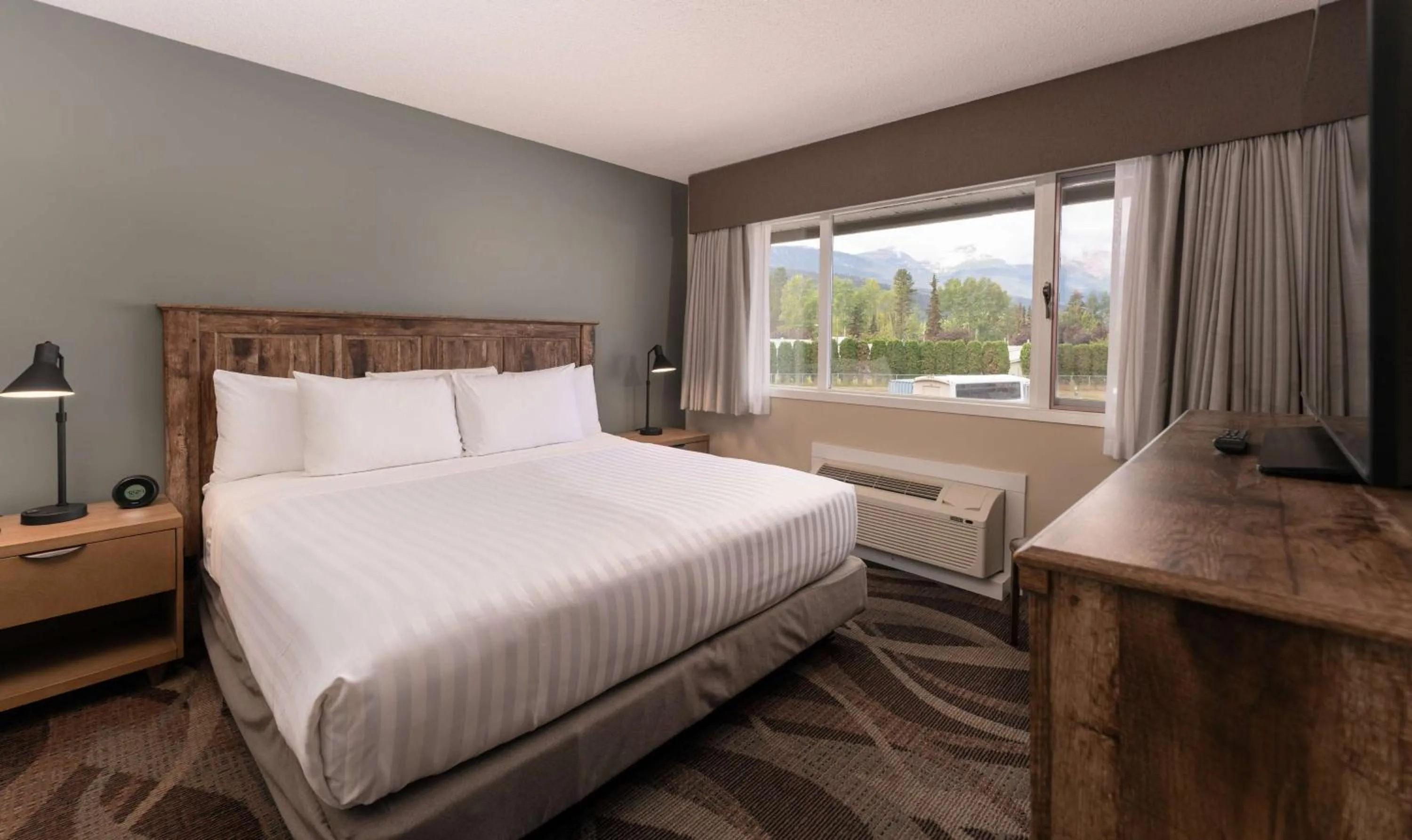 One Bedroom King Suite with Kitchenette in Prestige Hudson Bay Lodge & Conference Centre, WorldHotels Crafted Collection