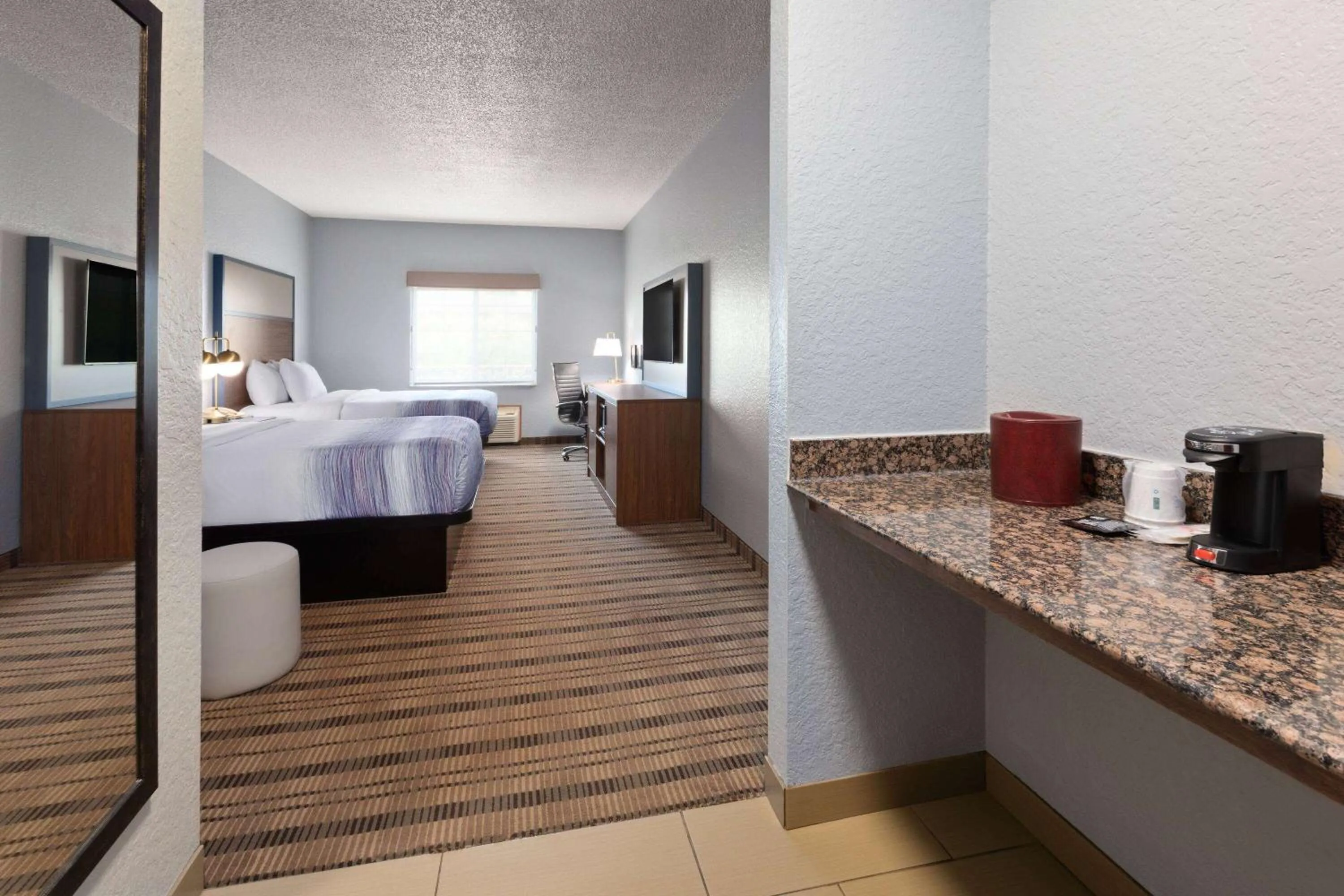 Queen Room with Two Queen Beds - Non-Smoking in AmericInn by Wyndham Grinnell