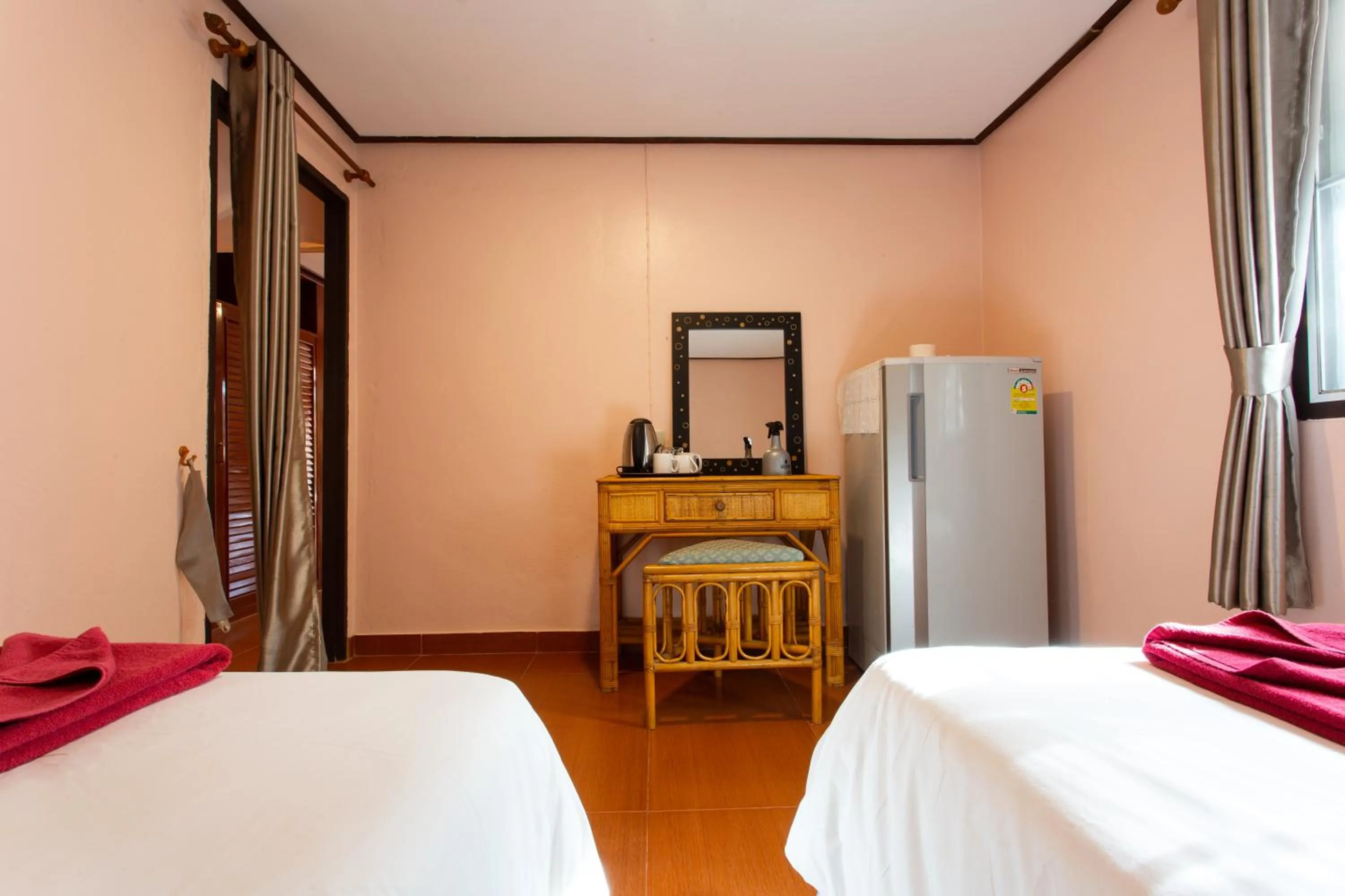 Economy Quadruple Room with Shared Bathroom in Harry's Bungalows