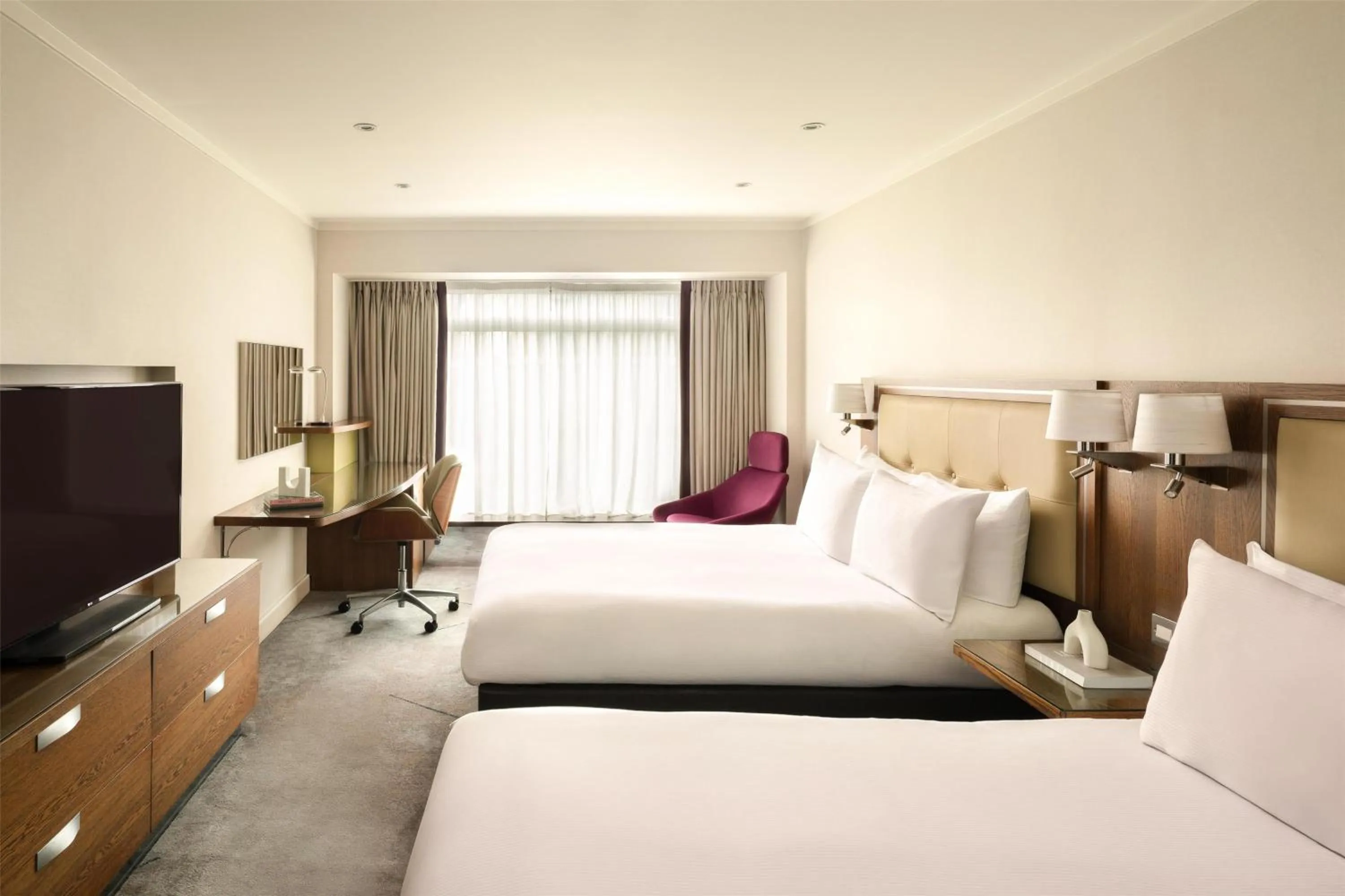 Four Queen Bed Family Connecting Room in Hilton London Metropole