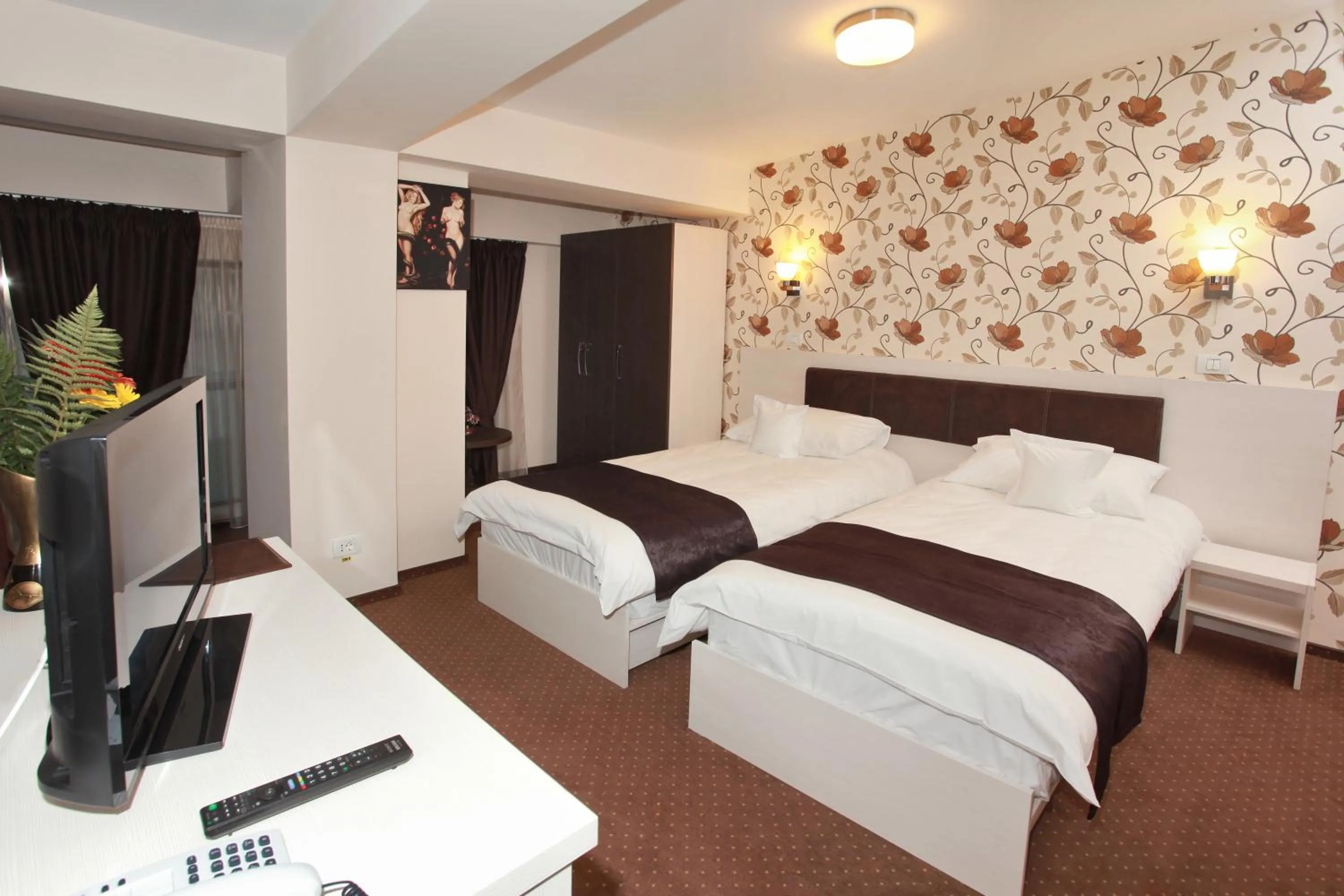 Bed in West Plaza Hotel