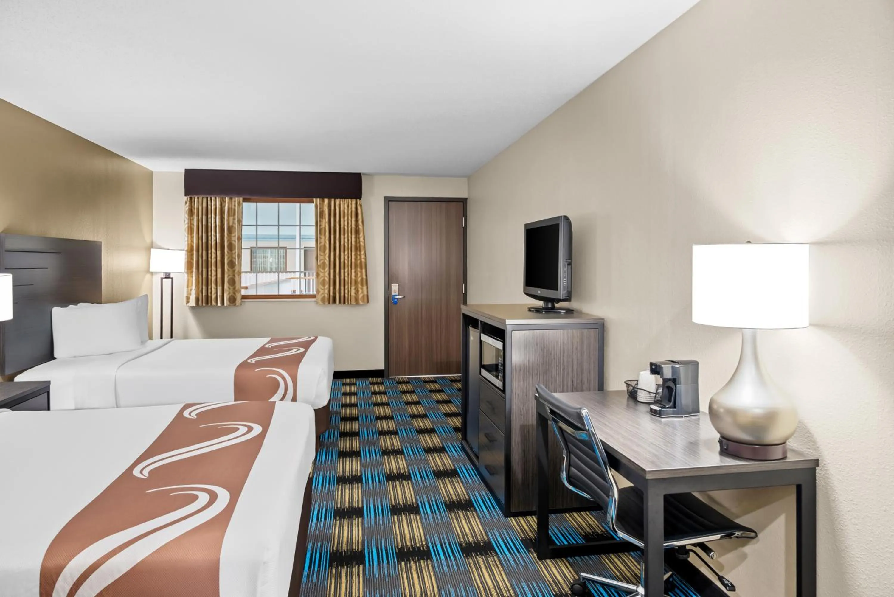 Queen Room with Two Queen Beds - Non-Smoking/Poolside in Rodeway Inn Grandville - Grand Rapids