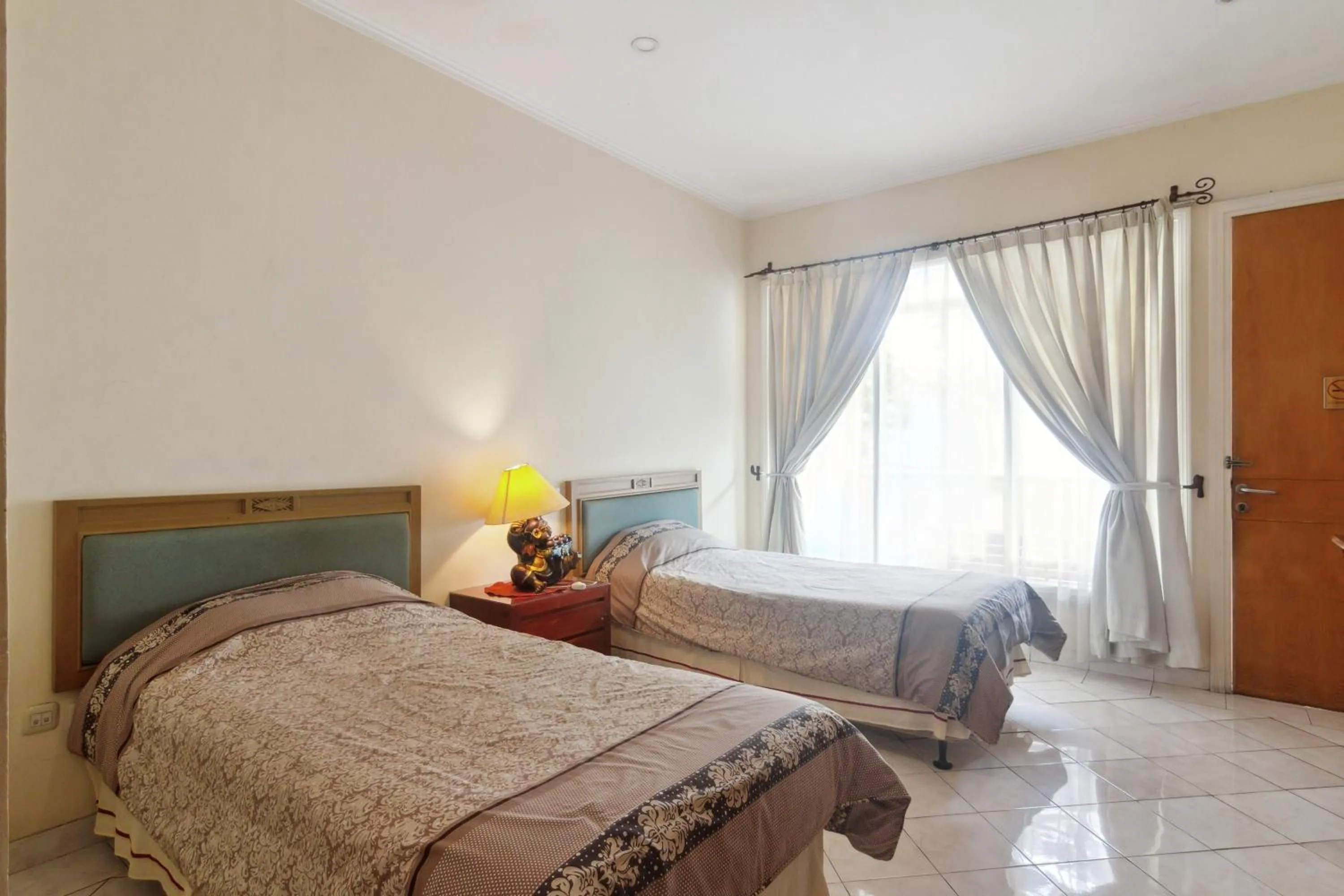 Large Twin Room in Puri Sawo Manila