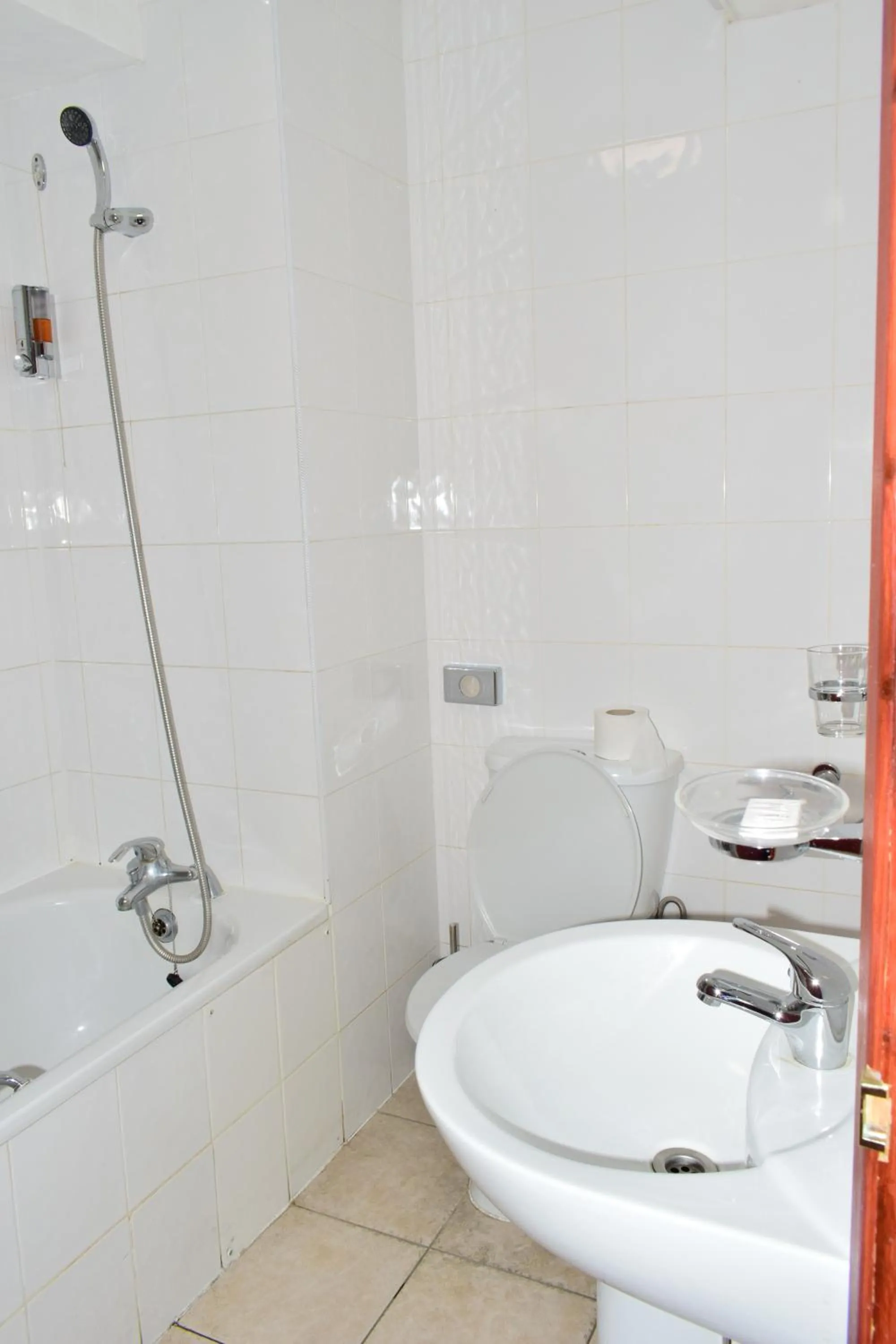 Quadruple Room with Private Bathroom in Bridge Park Hotel