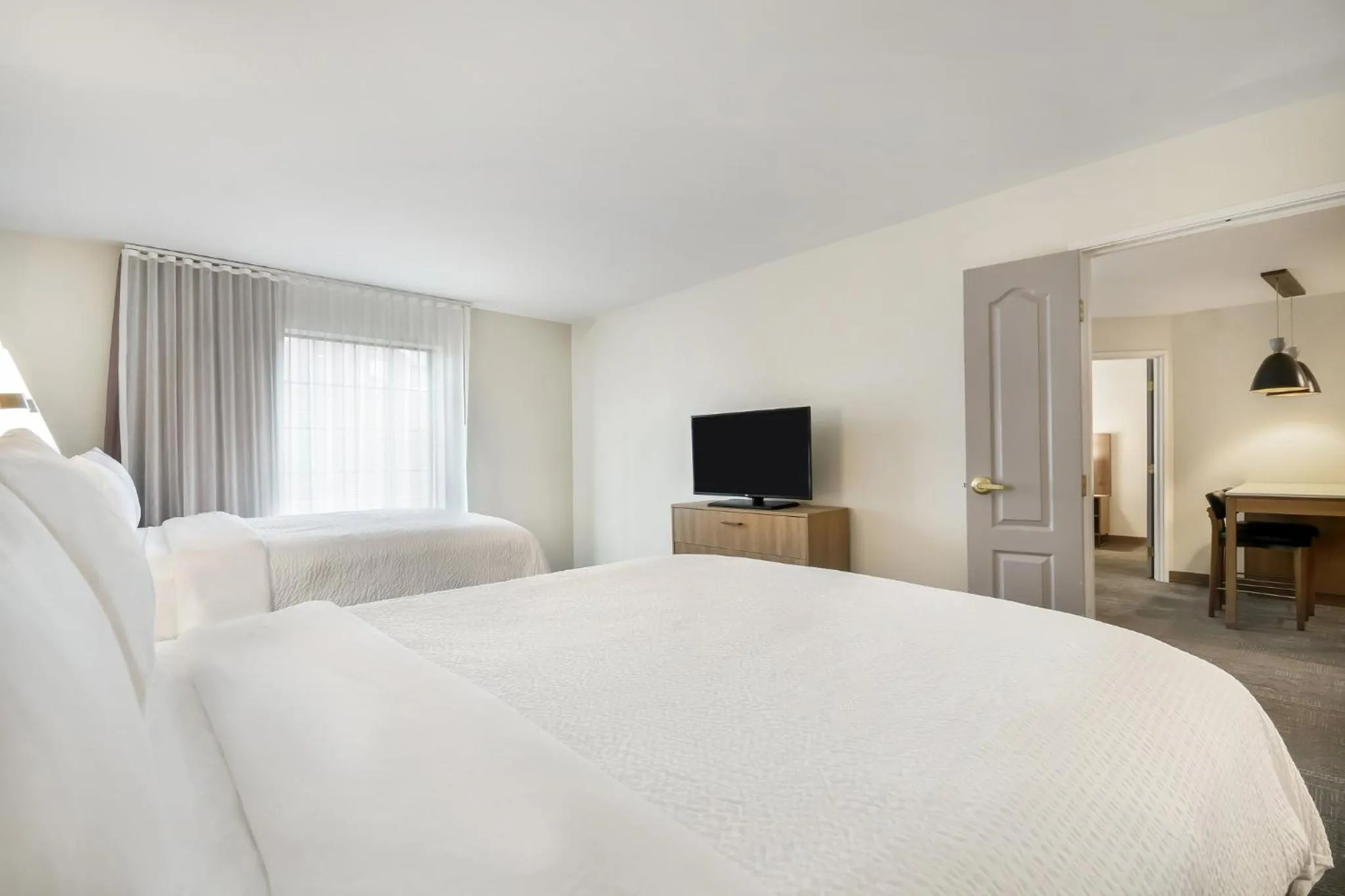 Two-Bedroom Suite with One King and Two Queen Beds - Hearing Accessible in Staybridge Suites Toledo/Maumee by IHG