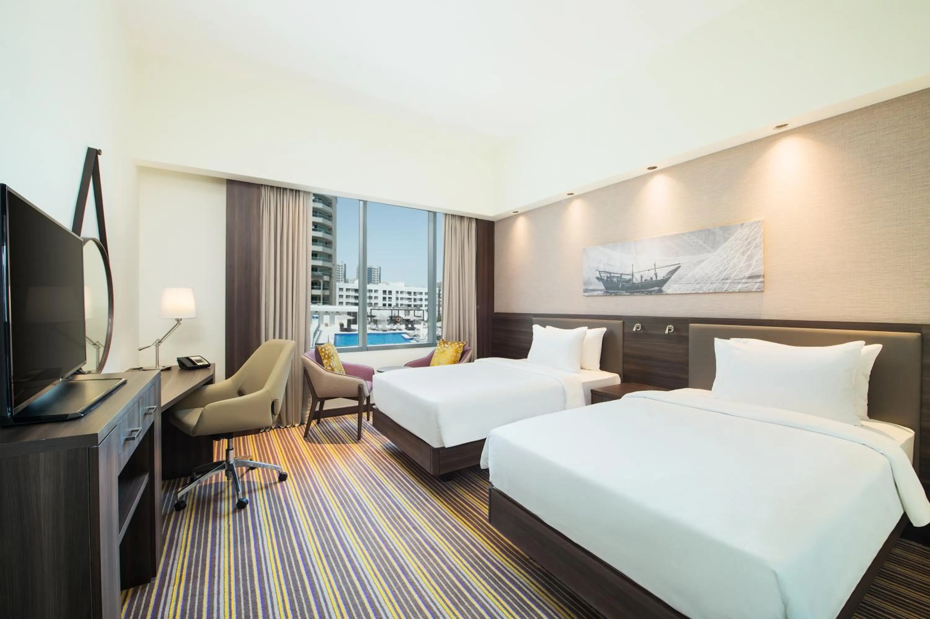 Twin Family Connecting Room with Sofa Bed in Hampton By Hilton Dubai Airport