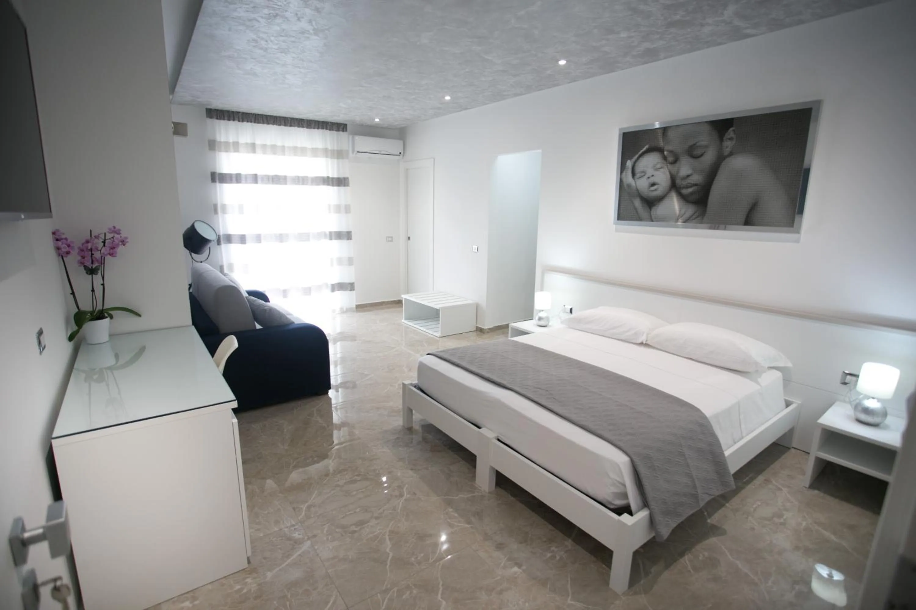 Deluxe Quadruple Room in Tropea Luxury & Charm
