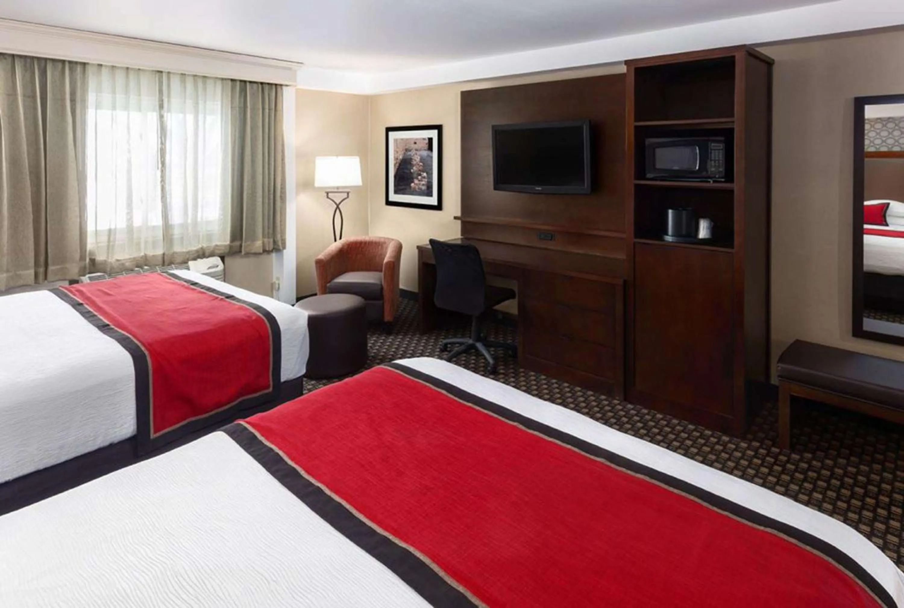 Queen Room with Two Queen Beds and Sofa Bed in Best Western Plus Ramkota Hotel