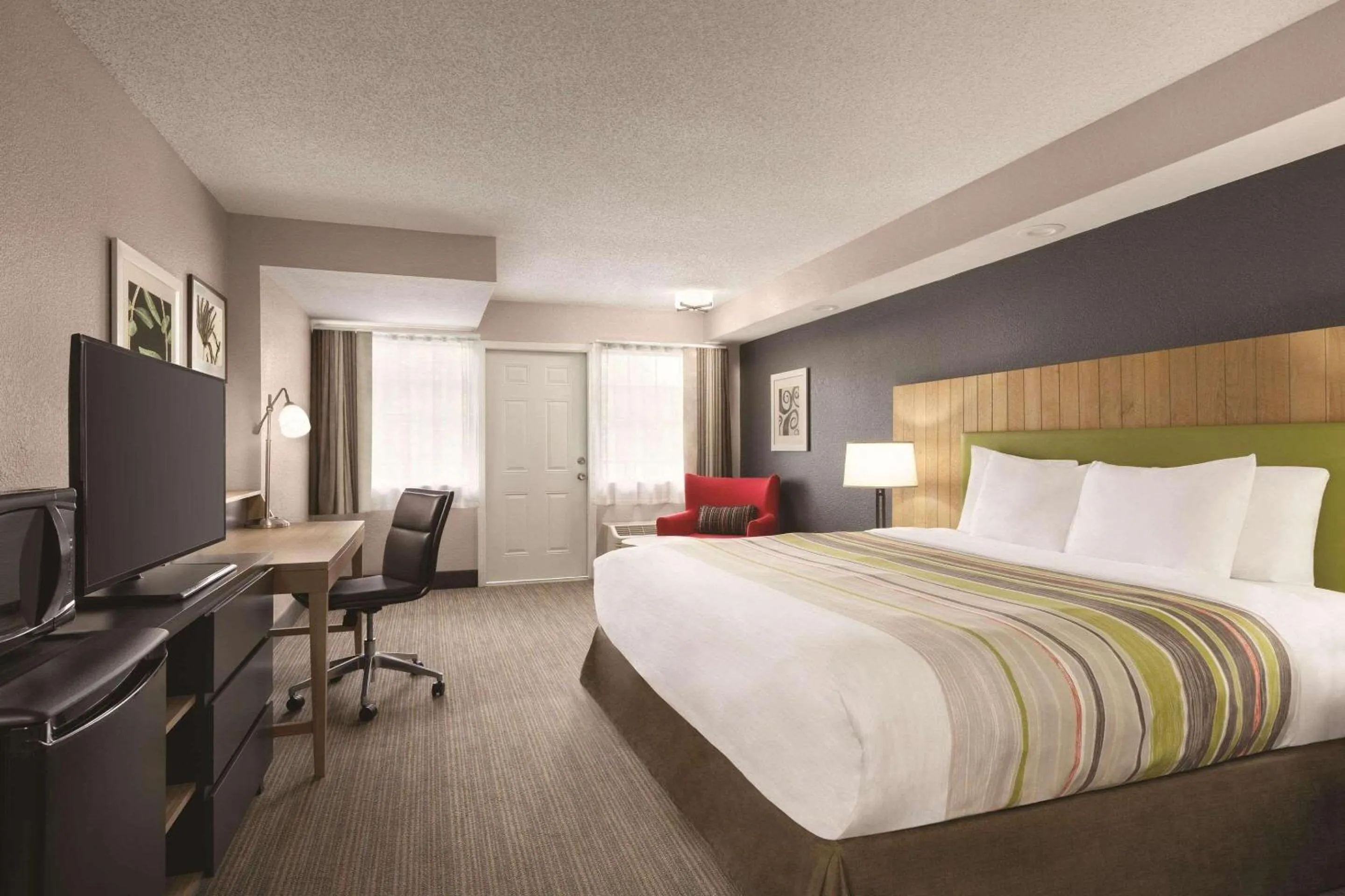 Premium King Room with Balcony - Non-Smoking in Country Inn & Suites by Radisson, Pigeon Forge South, TN