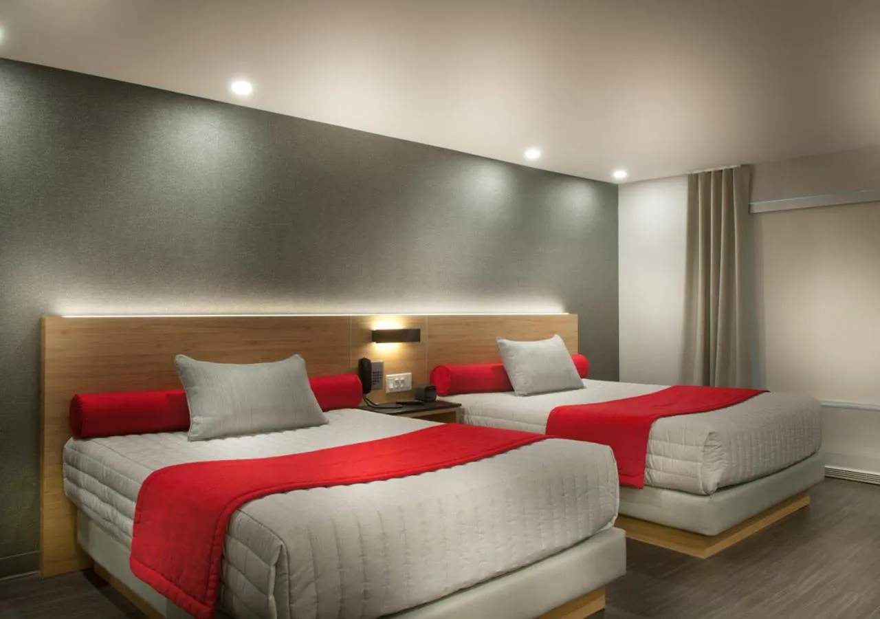 Quadruple Room with Two Queen Beds - Non Smoking in Ramada by Wyndham Laval