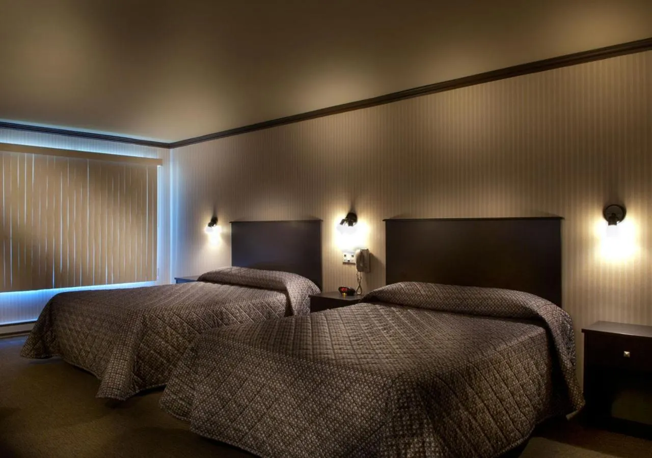 Classic Quadruple Room in Ramada by Wyndham Laval