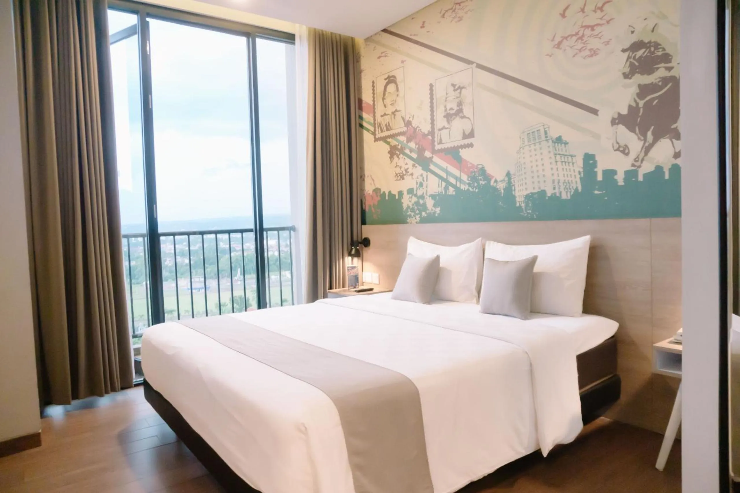 Double Room with Balcony in Hotel Fortunagrande Jember By Fosia Hotels