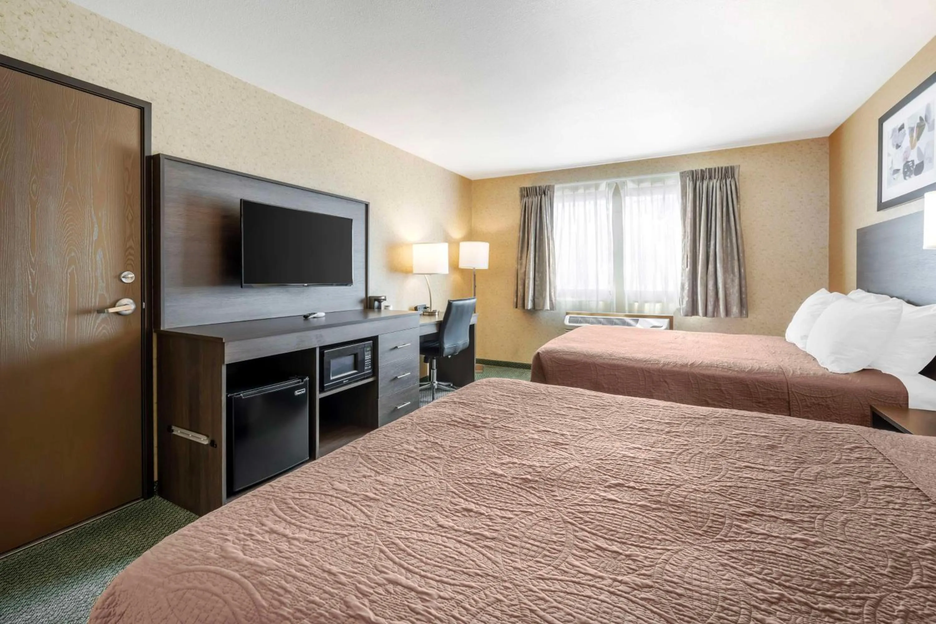Queen Room with Two Queen Beds in SureStay Plus by Best Western Enterprise