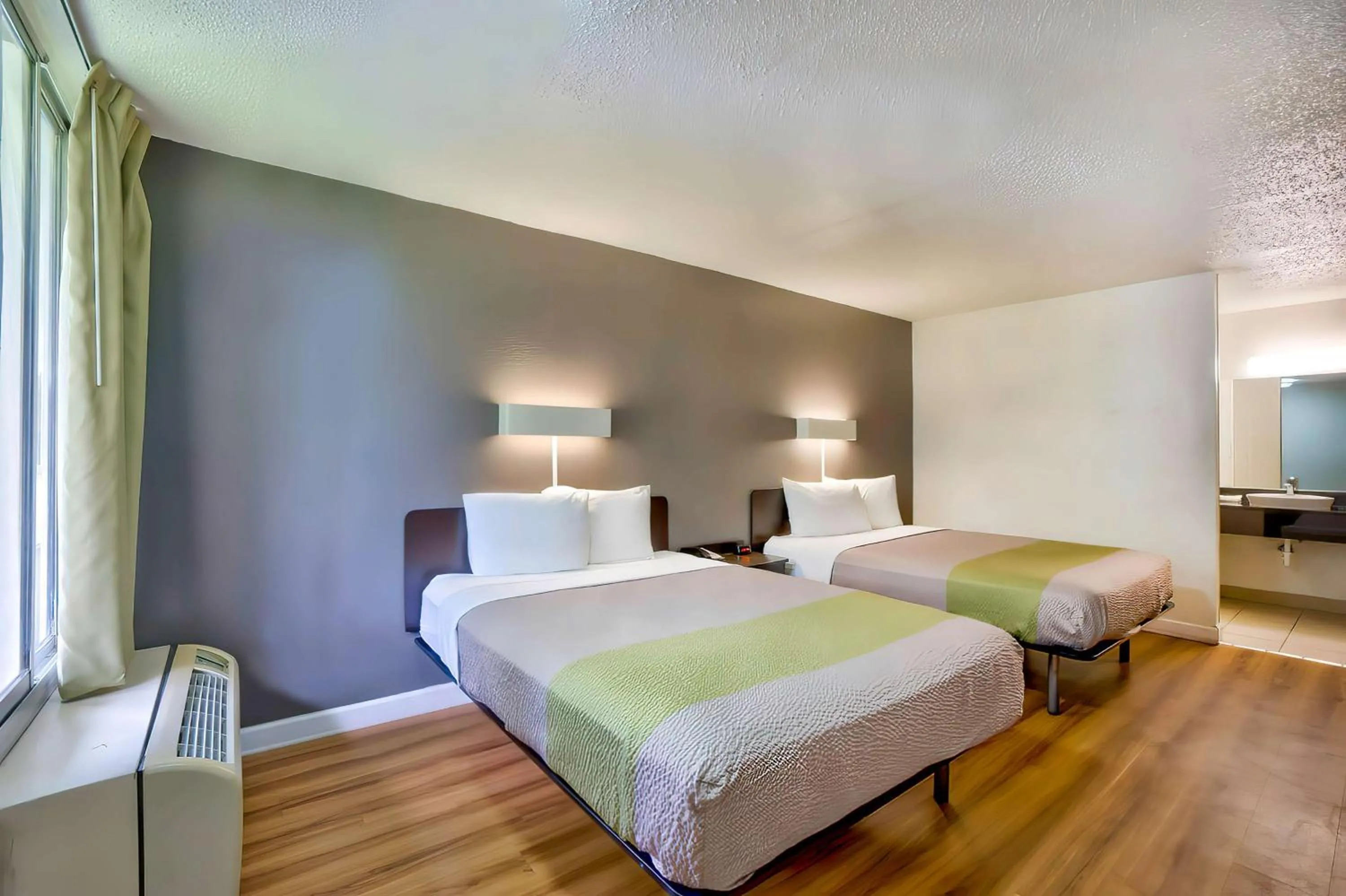 Deluxe Queen Room with Two Queen Beds - Smoking in Motel 6-Gainesville, FL