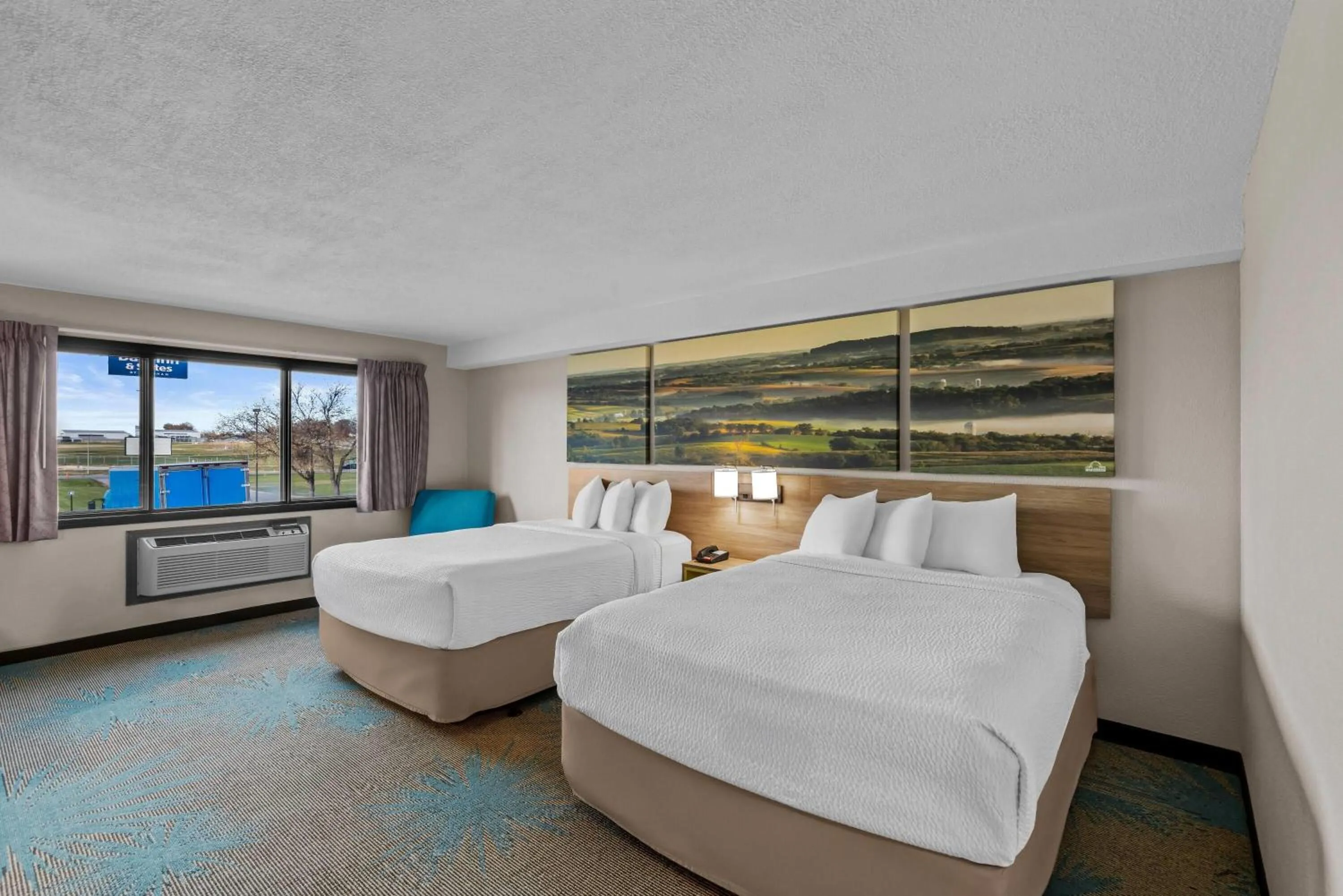 Deluxe Queen Room with Two Queen Beds - Non-Smoking in Days Inn & Suites by Wyndham Des Moines Airport