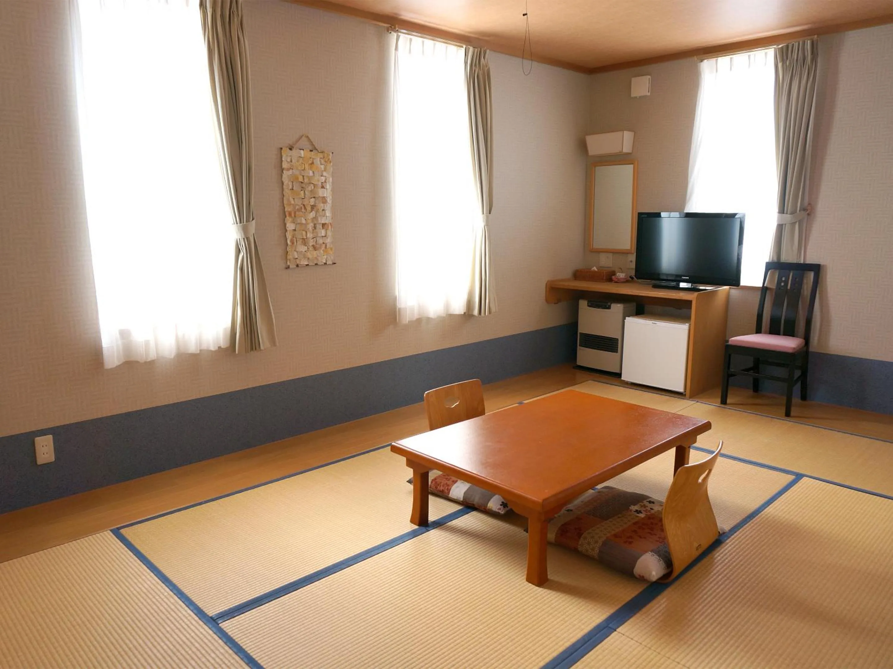 Quadruple Room in Petit Hotel Blaneneige