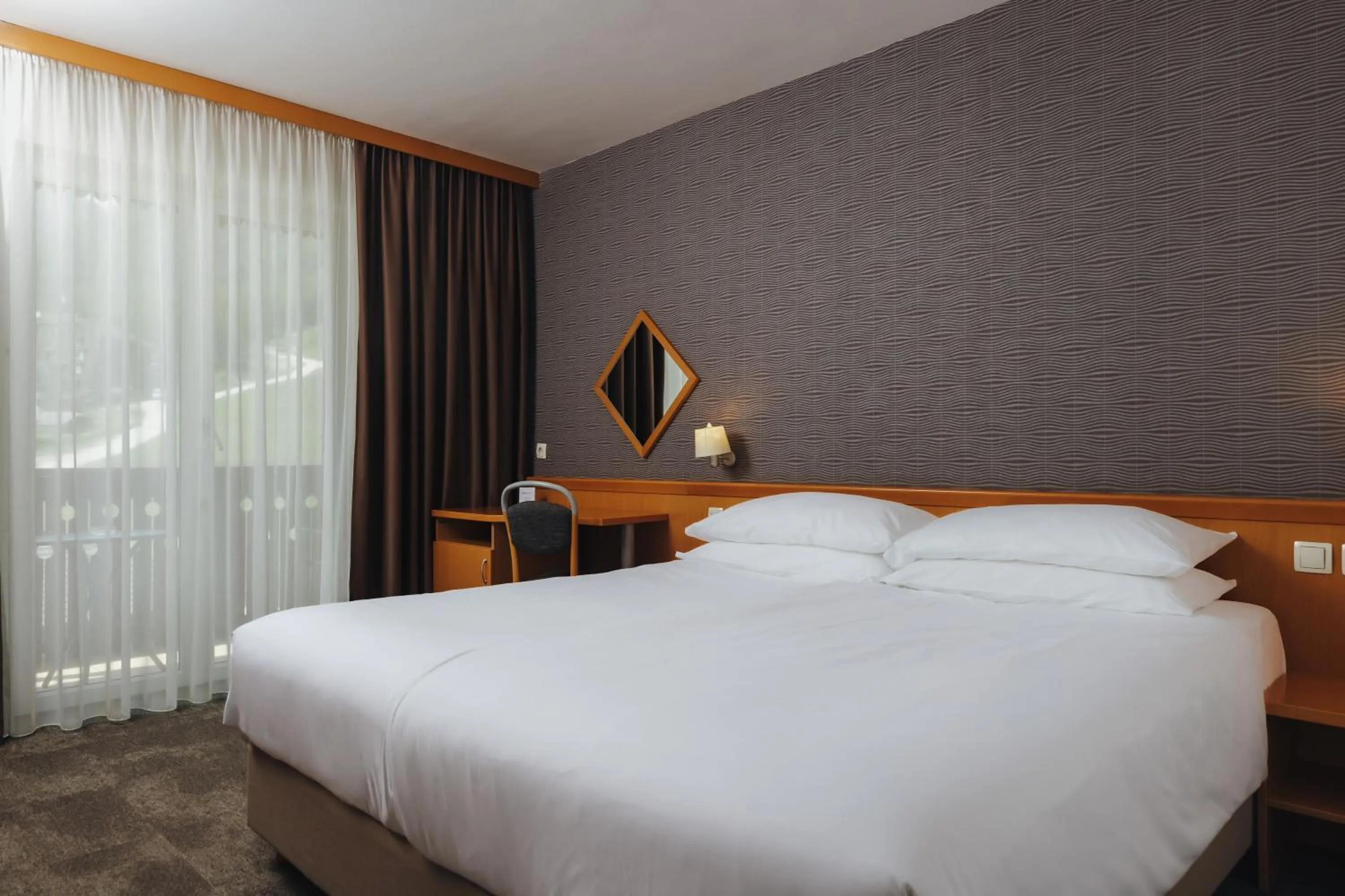 Room with One King or Two Twin Beds - Non-Smoking in Ramada Resort Kranjska Gora