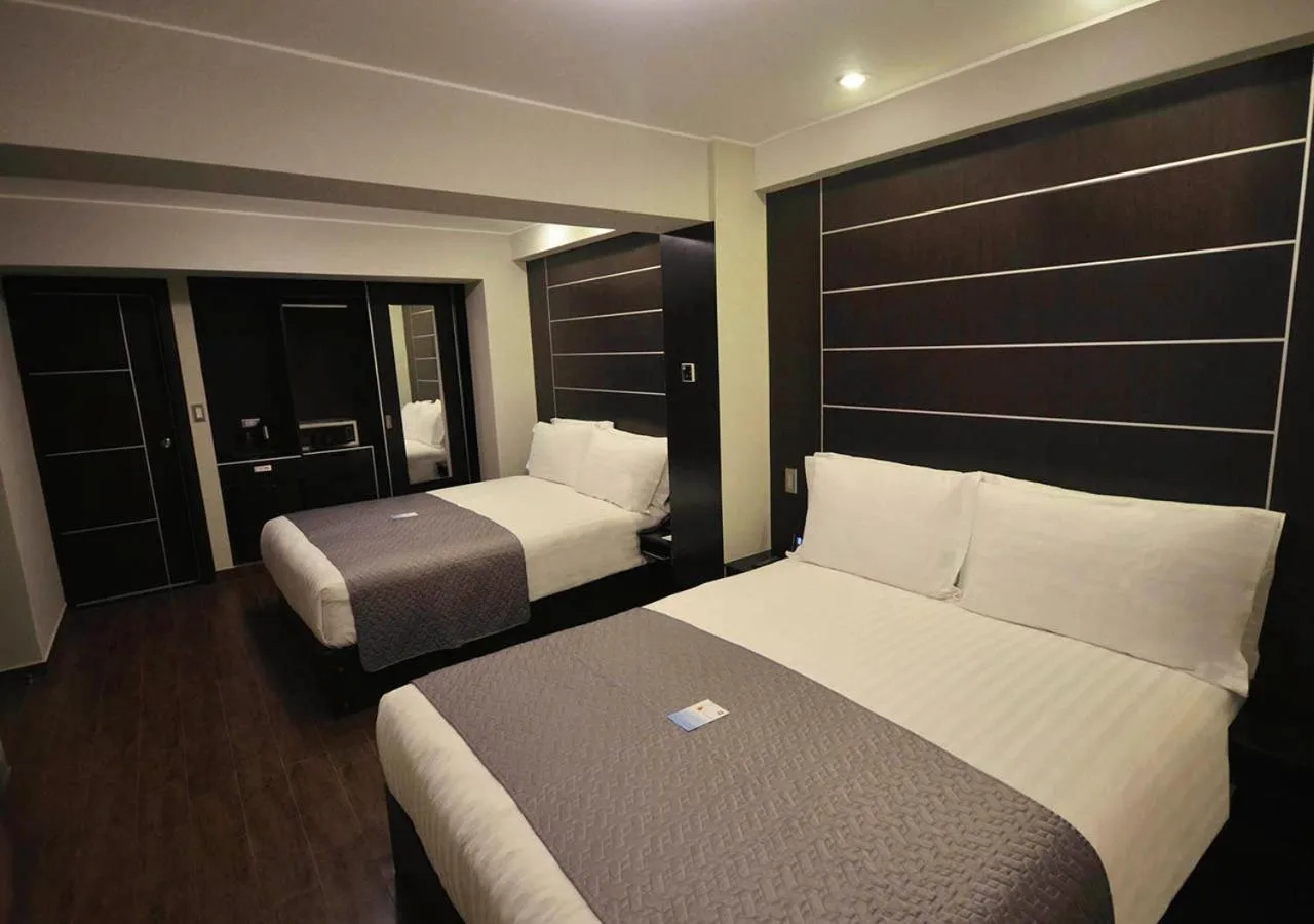 Standard Queen Room with Two Queen Beds in qp Hotels Trujillo