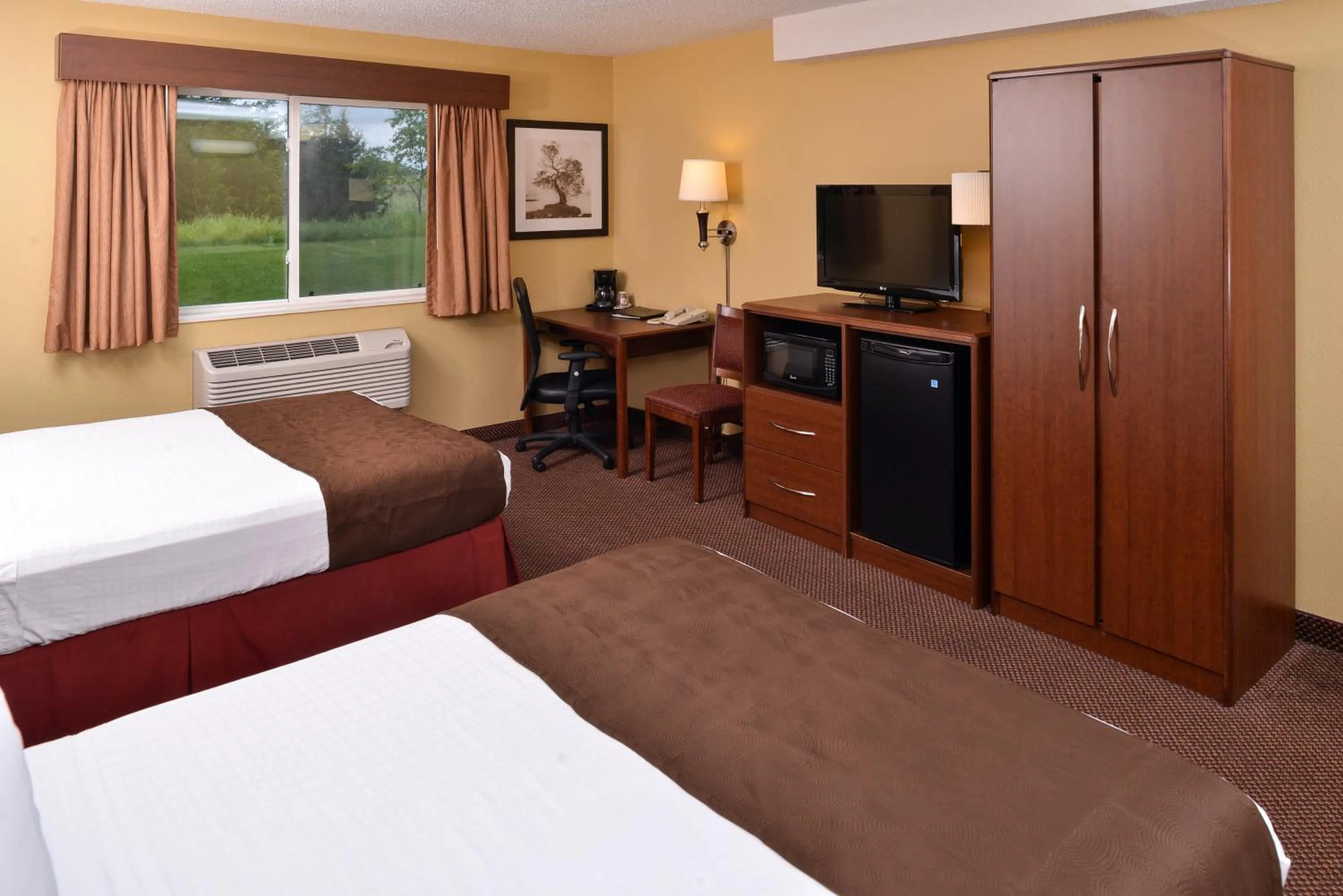 Deluxe Queen Room with Two Queen Beds and Roll-In shower - Mobility Accessible/Non-Smoking in AmericInn by Wyndham St Cloud MN I-94