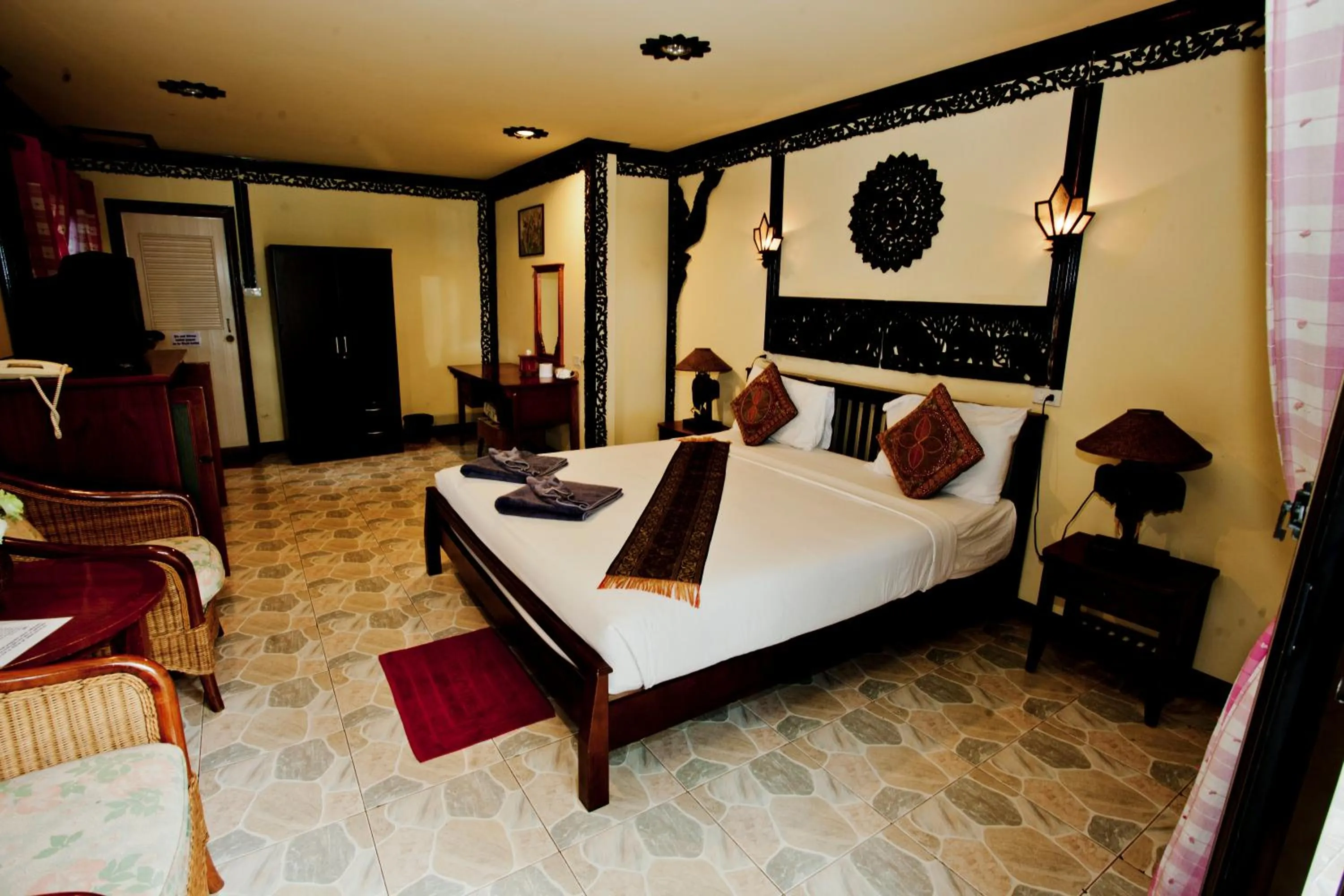 Queen Room with Balcony in Paradise Pearl Bungalows
