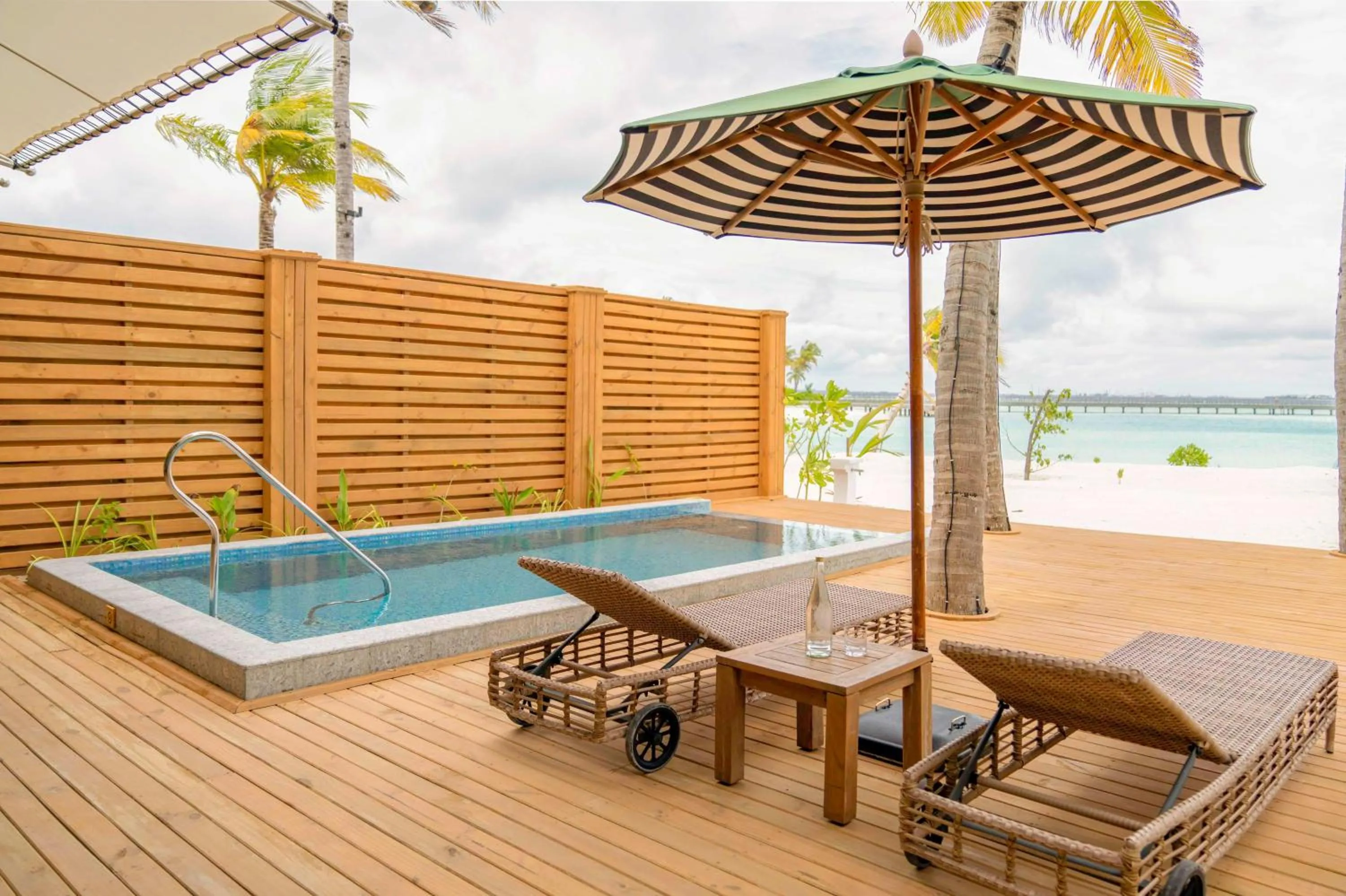 Two-Bedroom Family Beach Room with Pool in SAii Lagoon Maldives, Curio Collection By Hilton