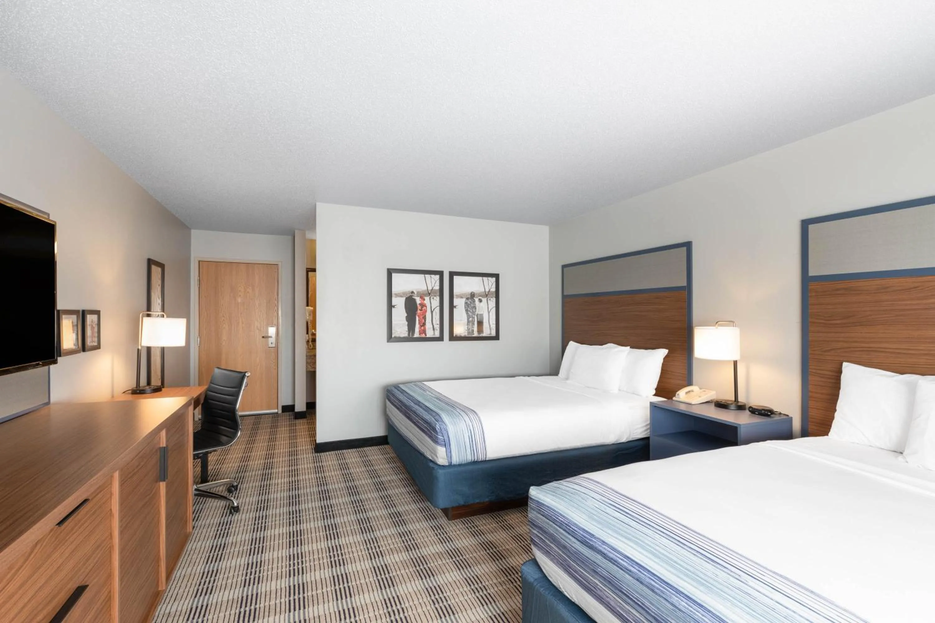 Deluxe Queen Room with Two Queen Beds - Non-Smoking in AmericInn by Wyndham Jackson