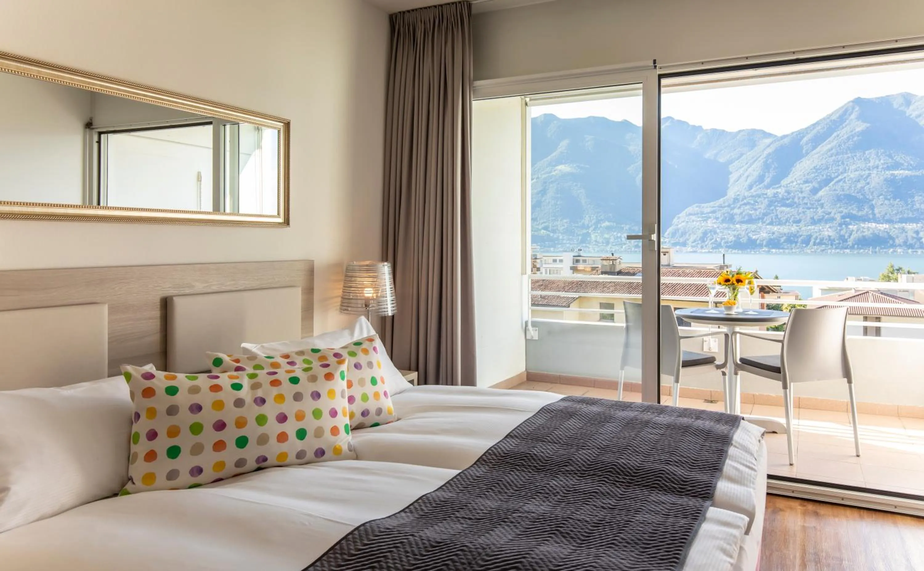 Double Room with Balcony and Lake View in Smart-HOTEL MINUSIO, a Swiss Quality Hotel