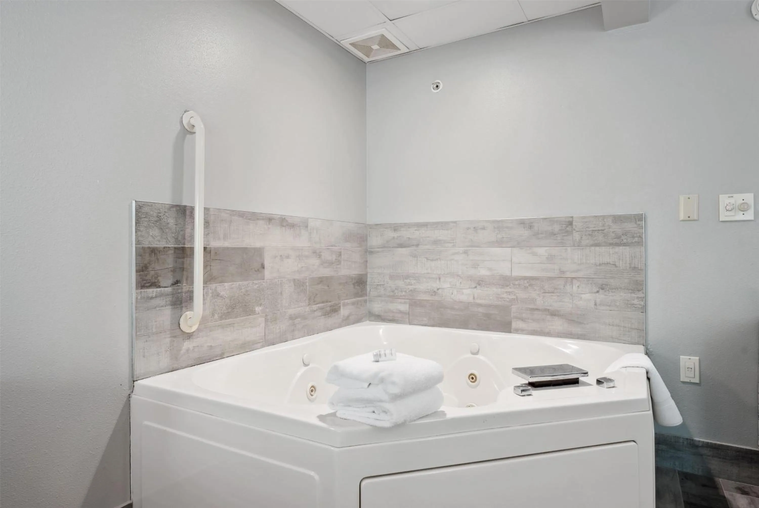 King Room with Jetted Tub and Forest View with Balcony - Non-Smoking in AmericInn by Wyndham Wisconsin Dells