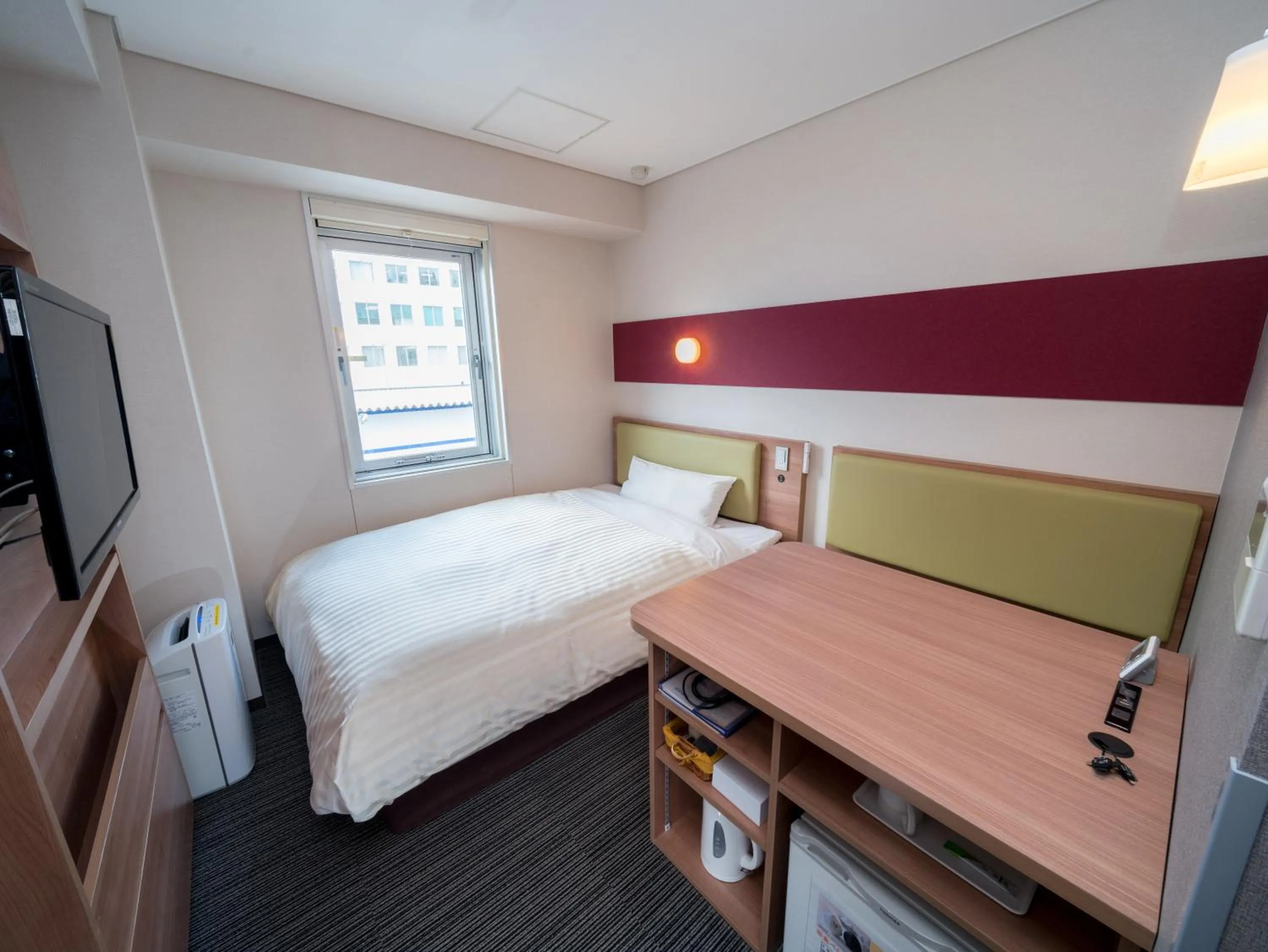 Bed in Super Hotel Aomori