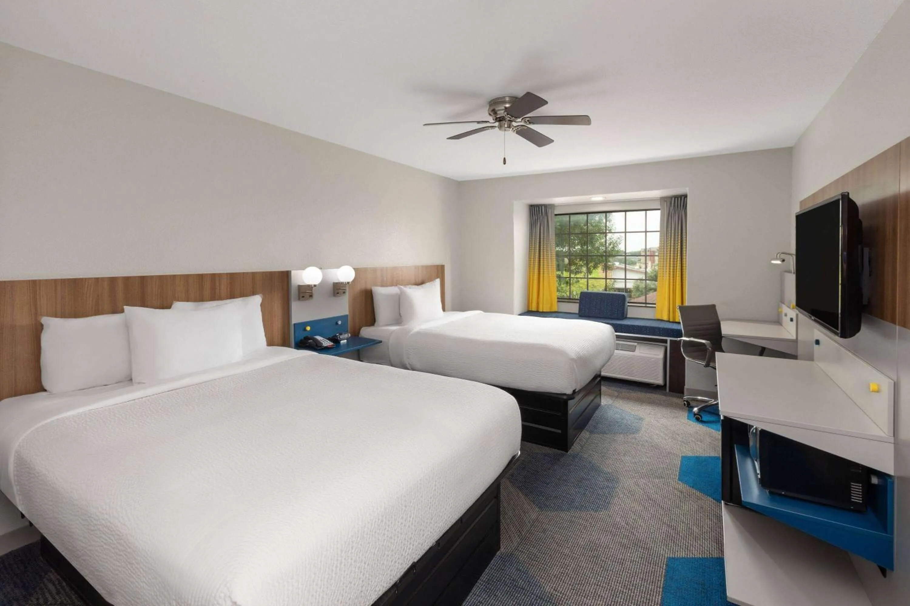 Queen Room with Two Queen Beds - Non-Smoking in Microtel Inn & Suites by Wyndham Buda Austin South