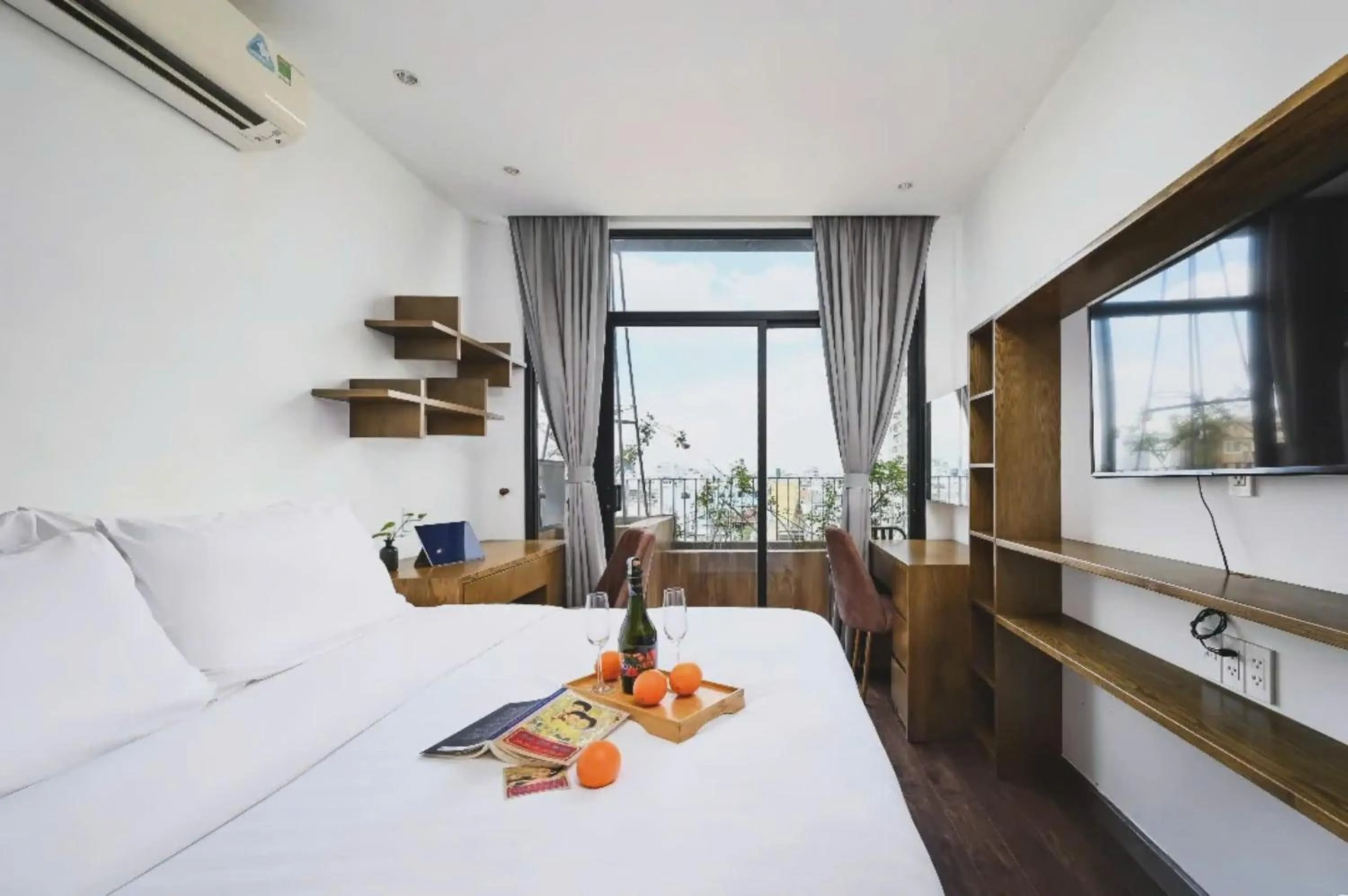 Two-Bedroom Family Suite, Bathtub, Kitchen and Balcony with Street & City View in The Bloom Pham Viet Chanh - Modern Living Space in Saigon - A Top Choice for Western Travelers