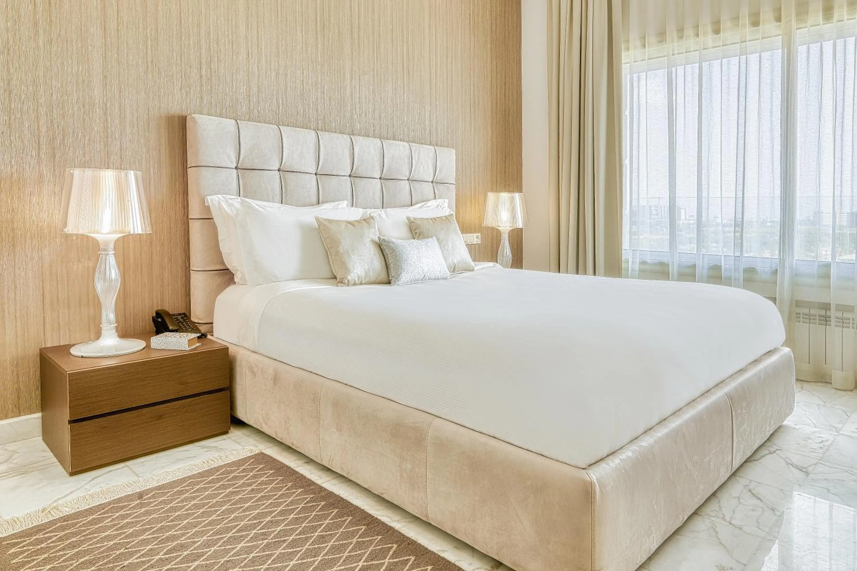 Deluxe Suite King-Size Bed – Lake View in ADAM Hotel Suites