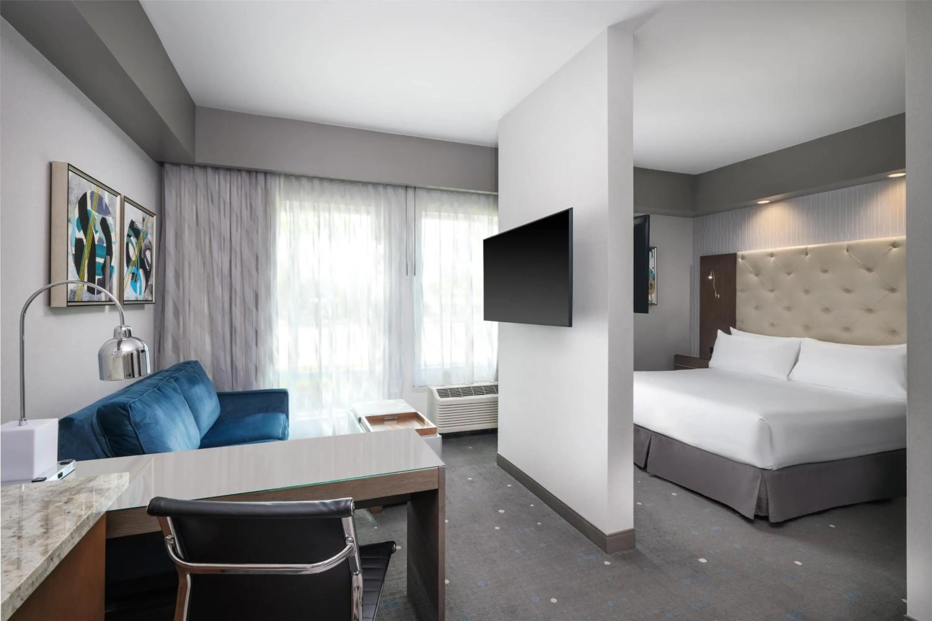 King Suite with Sofa Bed and Roll-In Shower - Mobility Access in Best Western Premier Hotel at Fisher's Landing
