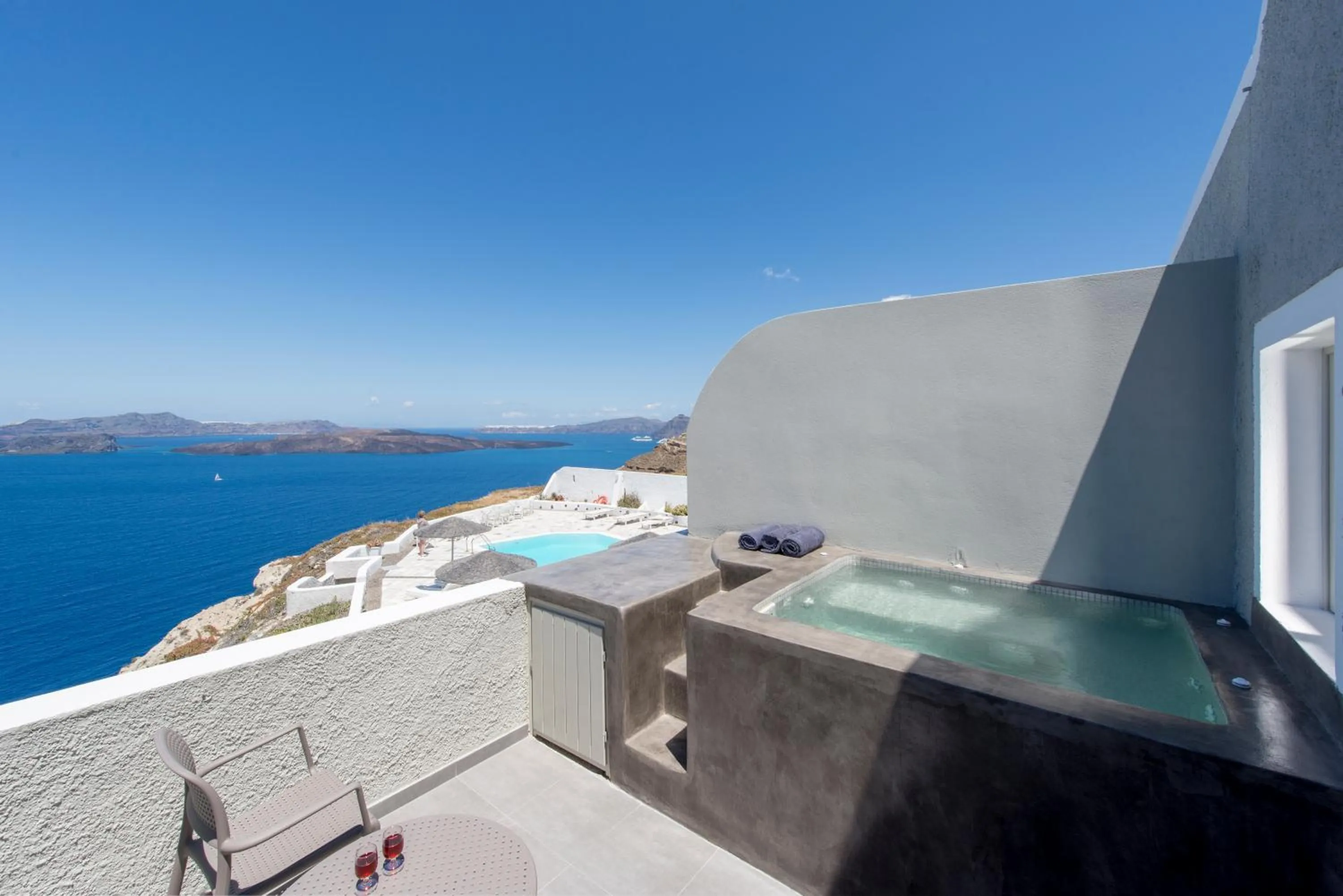 Deluxe Junior Suite with Outdoor Heated Whirlpool with Caldera and Sunset view in Caldera's Dolphin Suites