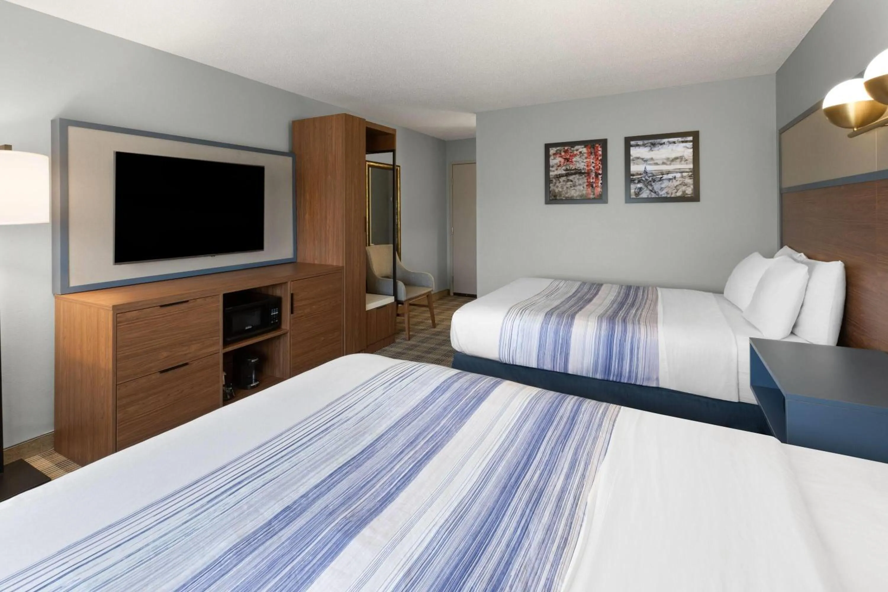 Queen Room with Two Queen Beds - Non-Smoking in AmericInn by Wyndham Chippewa Falls