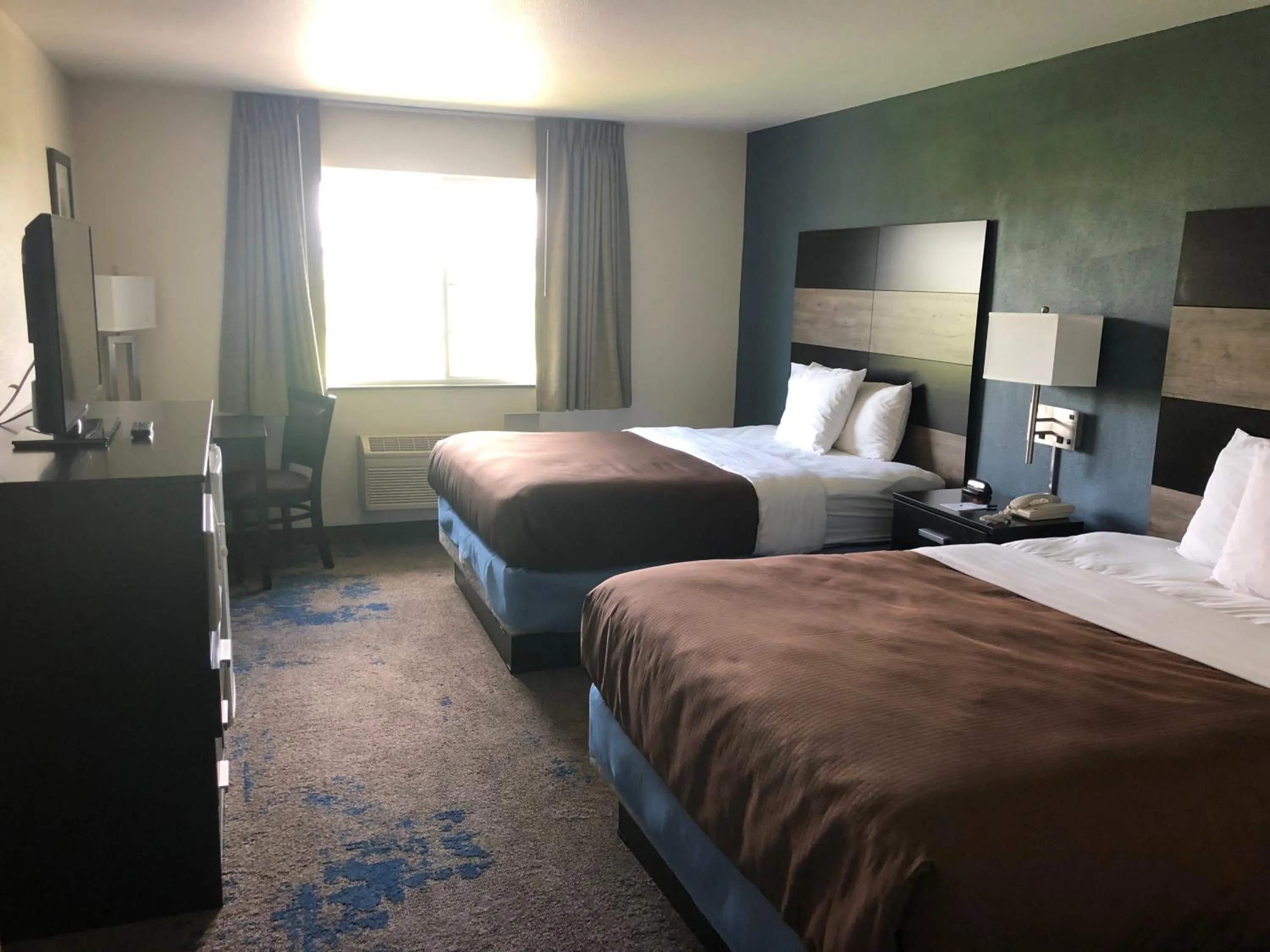 Queen Room with Two Queen Beds - Non-Smoking in AmericInn by Wyndham Maquoketa