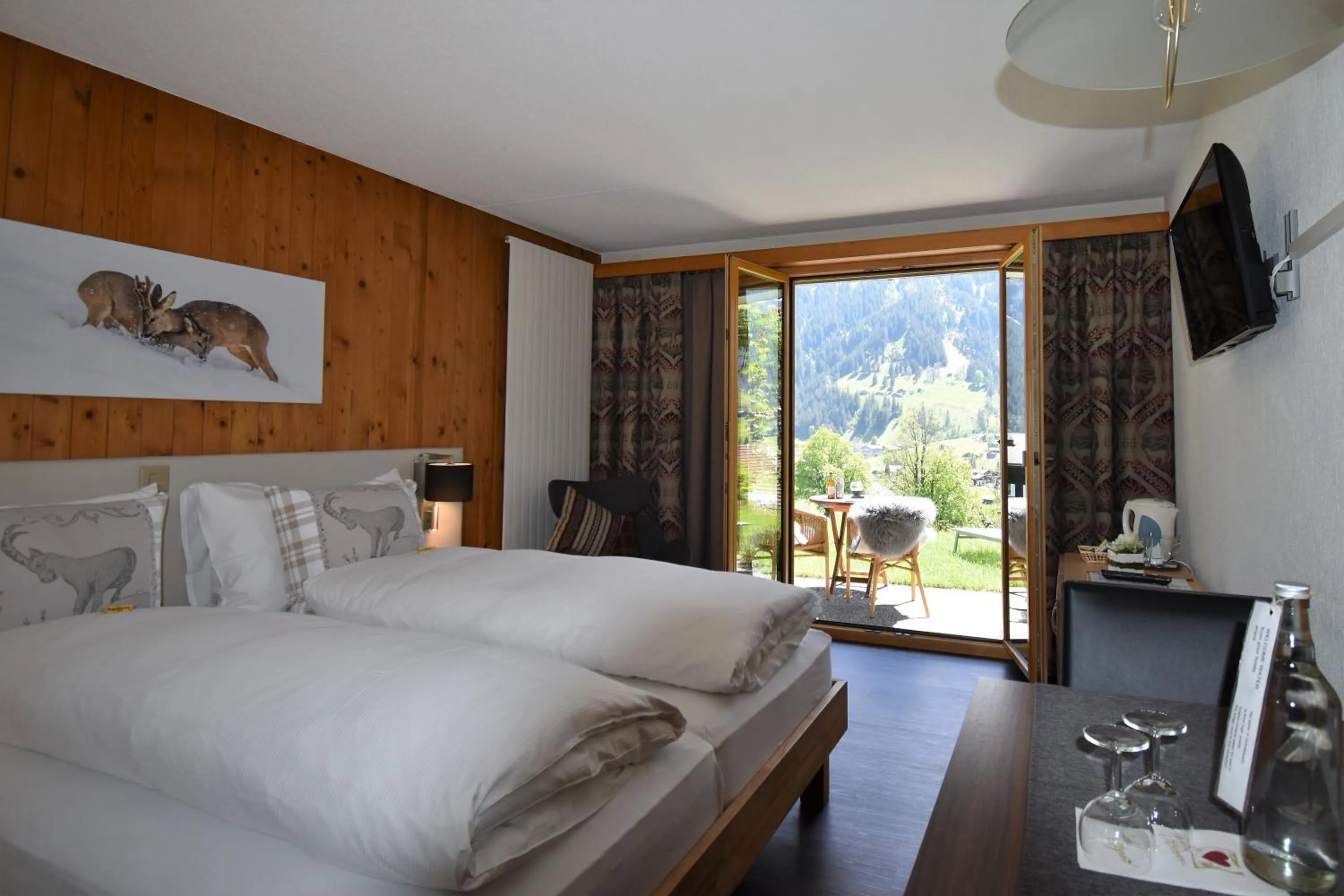 Superior Double Room Enzian with Eiger view and garden access in Hotel Cabana