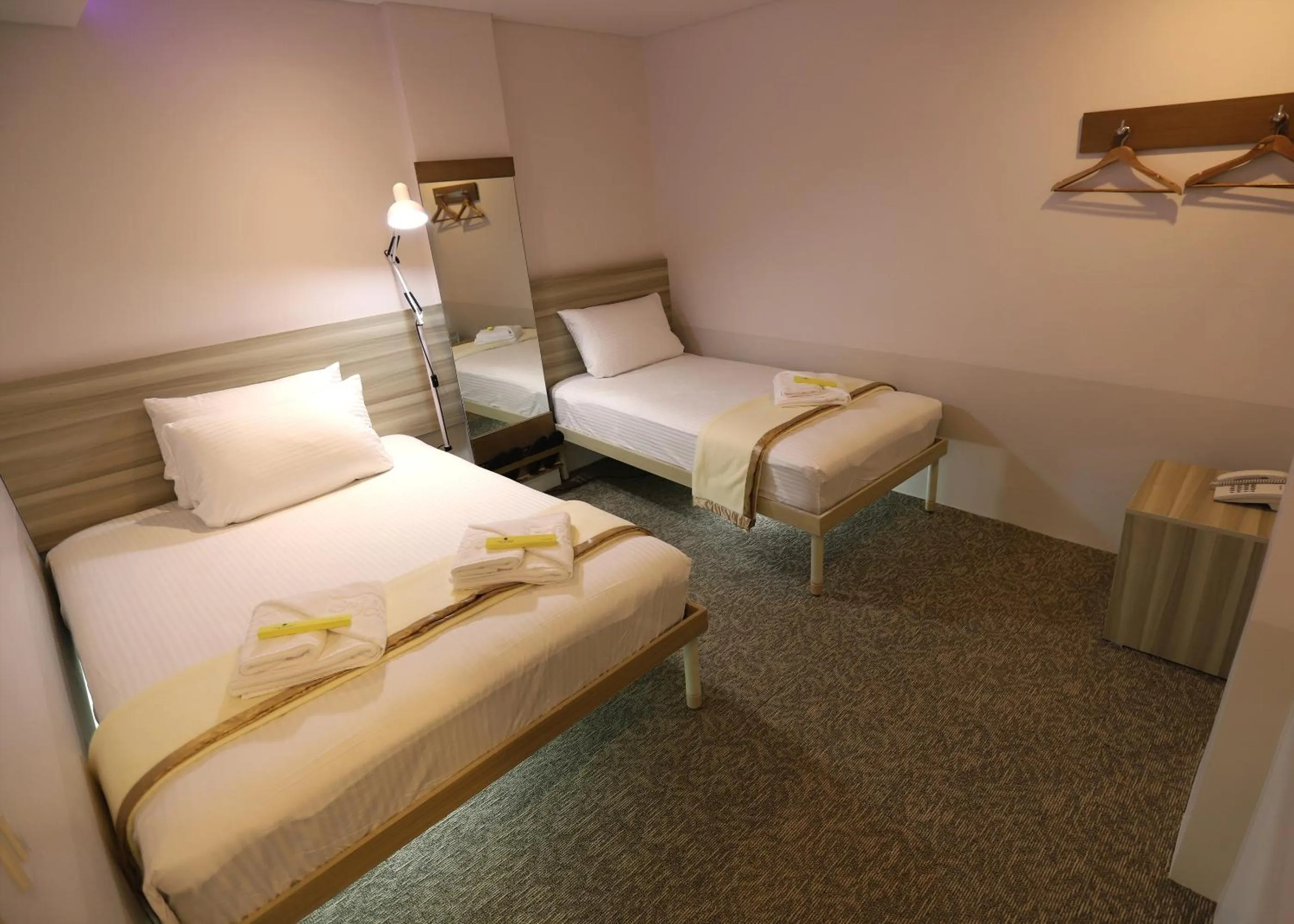 Family Room ( 1 Queen-sized bed and 1 Single sized bed ) in 1010 Hotel