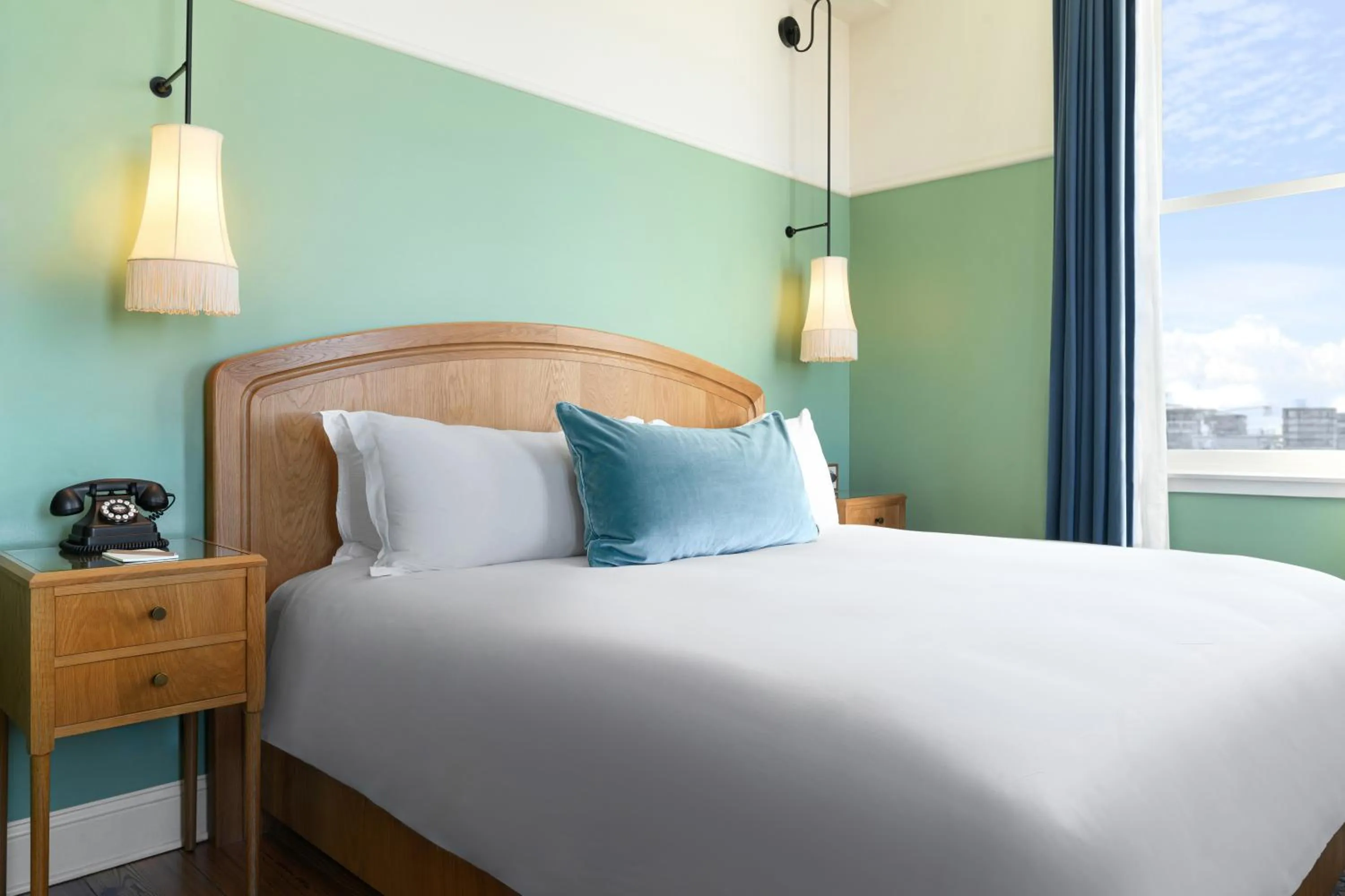 Junior King Suite with Seating Area in The Drayton Hotel Savannah, Curio Collection by Hilton