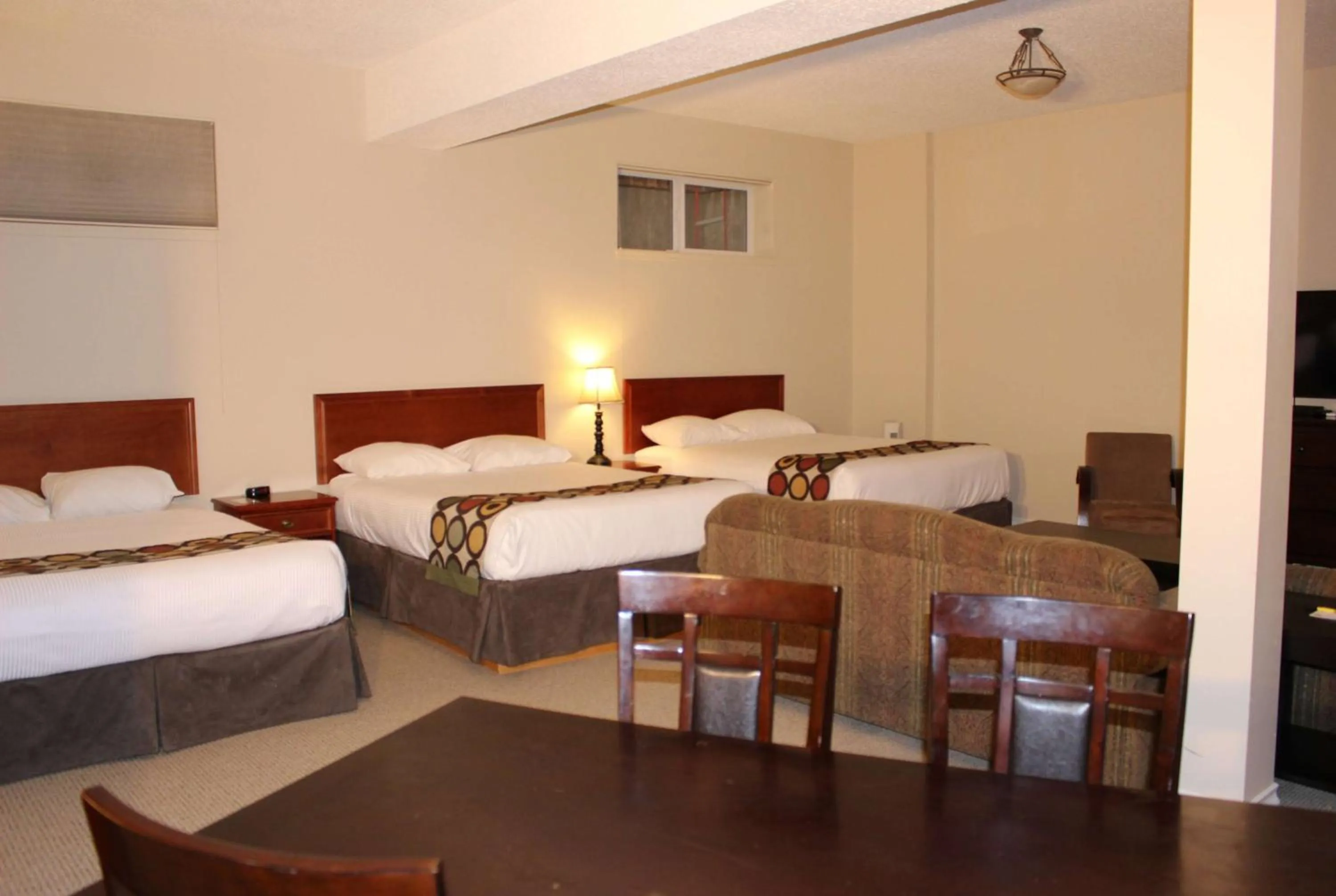 Queen Room with Three Queen Beds - Basement/Non-Smoking in Super 8 by Wyndham Cochrane