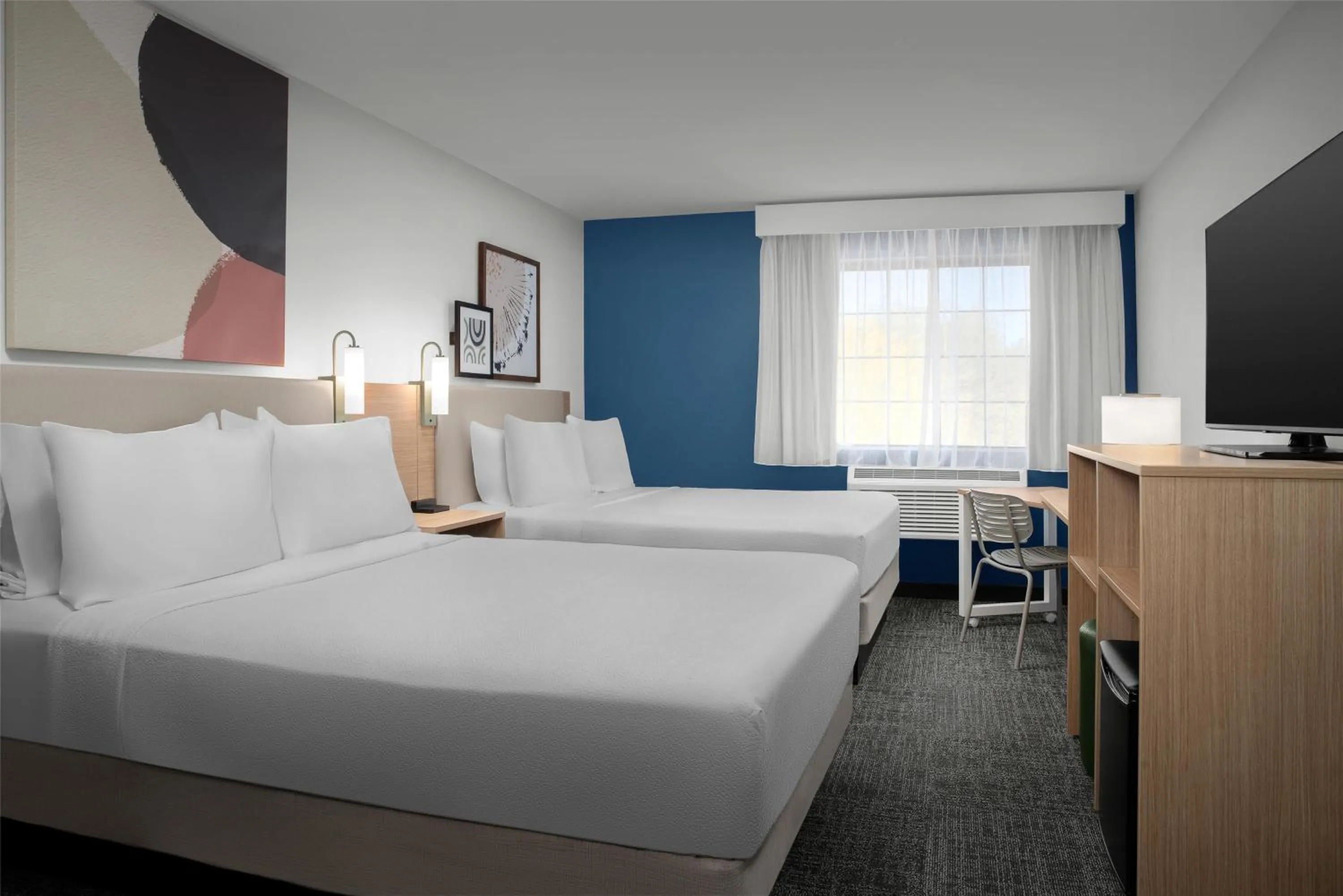 Queen Room with Two Queen Beds and Sofa in Spark By Hilton Tucson Airport