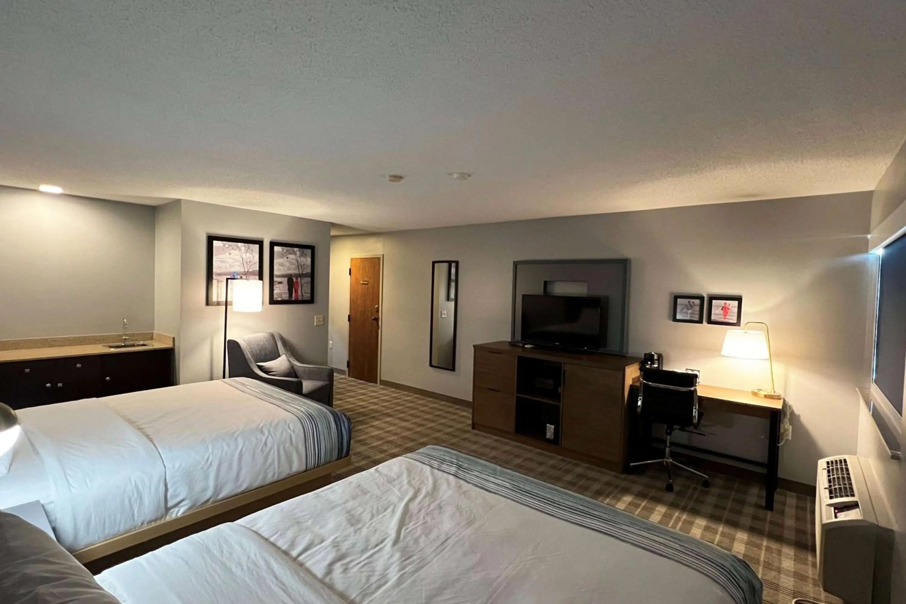 Queen Room with Two Queen Beds - Non-Smoking in AmericInn by Wyndham Marshfield