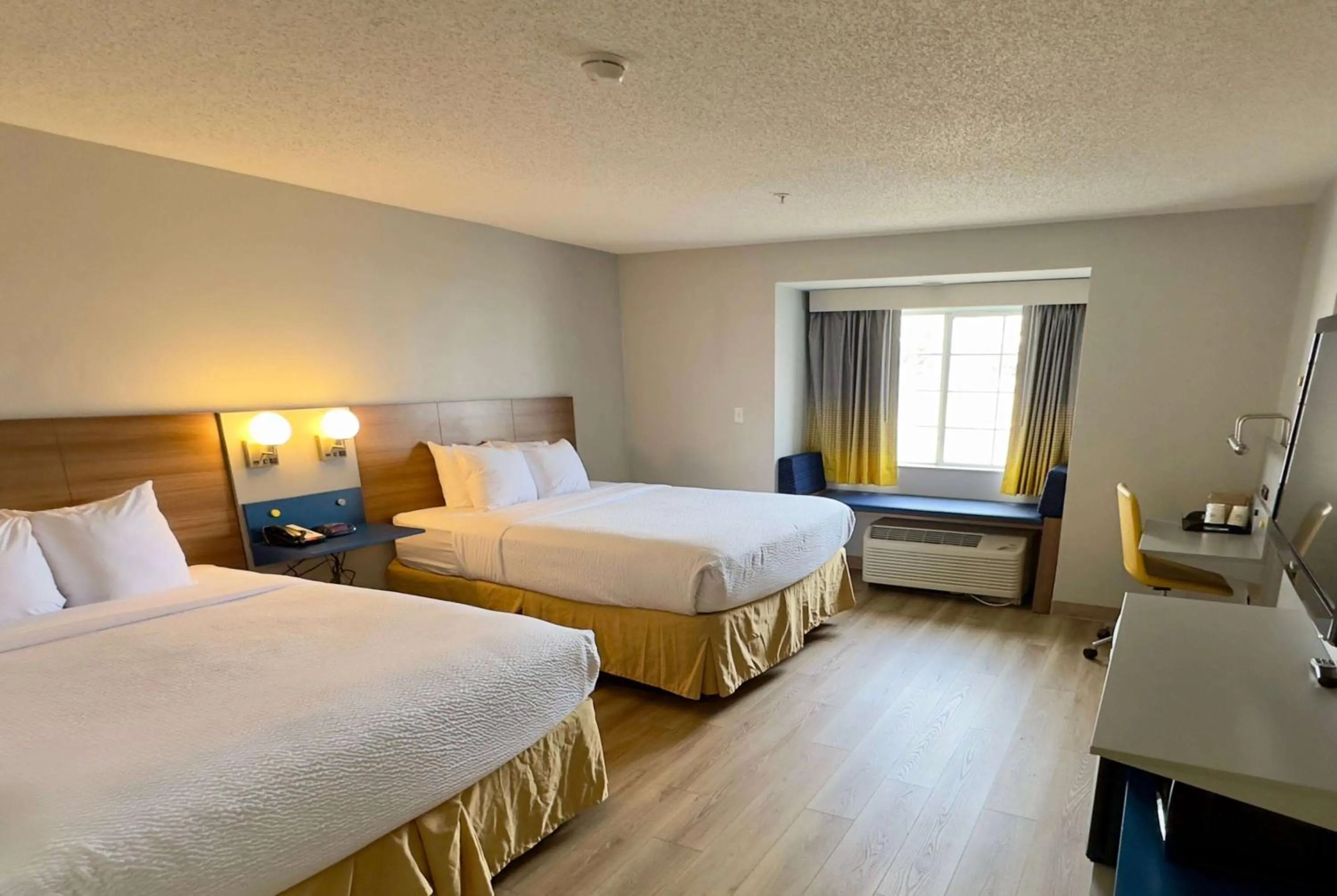 Queen Room with Two Queen Beds - Non-Smoking in Microtel Inn & Suites by Wyndham Denver Airport