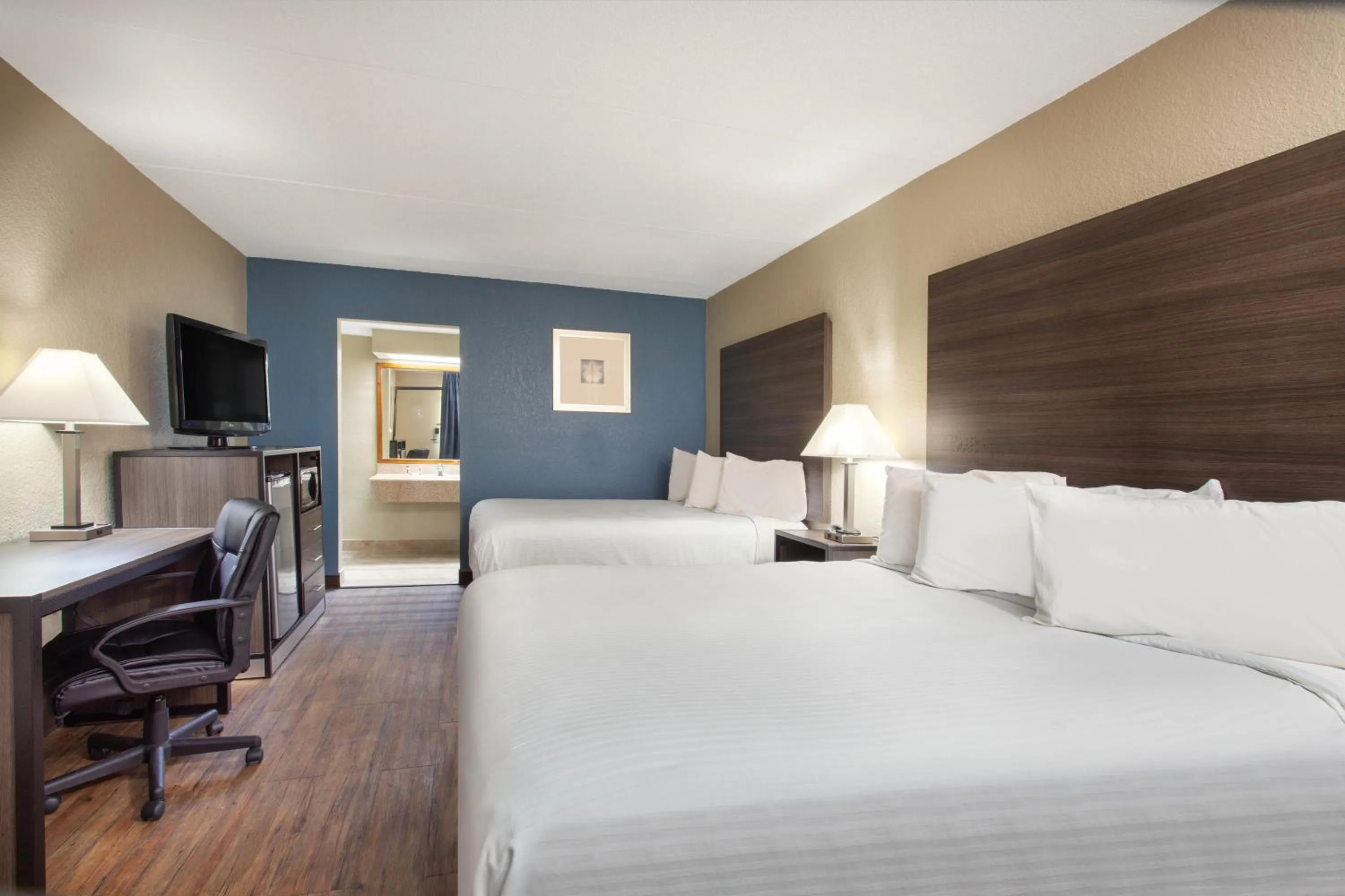 Queen Room with Two Queen Beds - Smoking in Travelodge by Wyndham Deltona