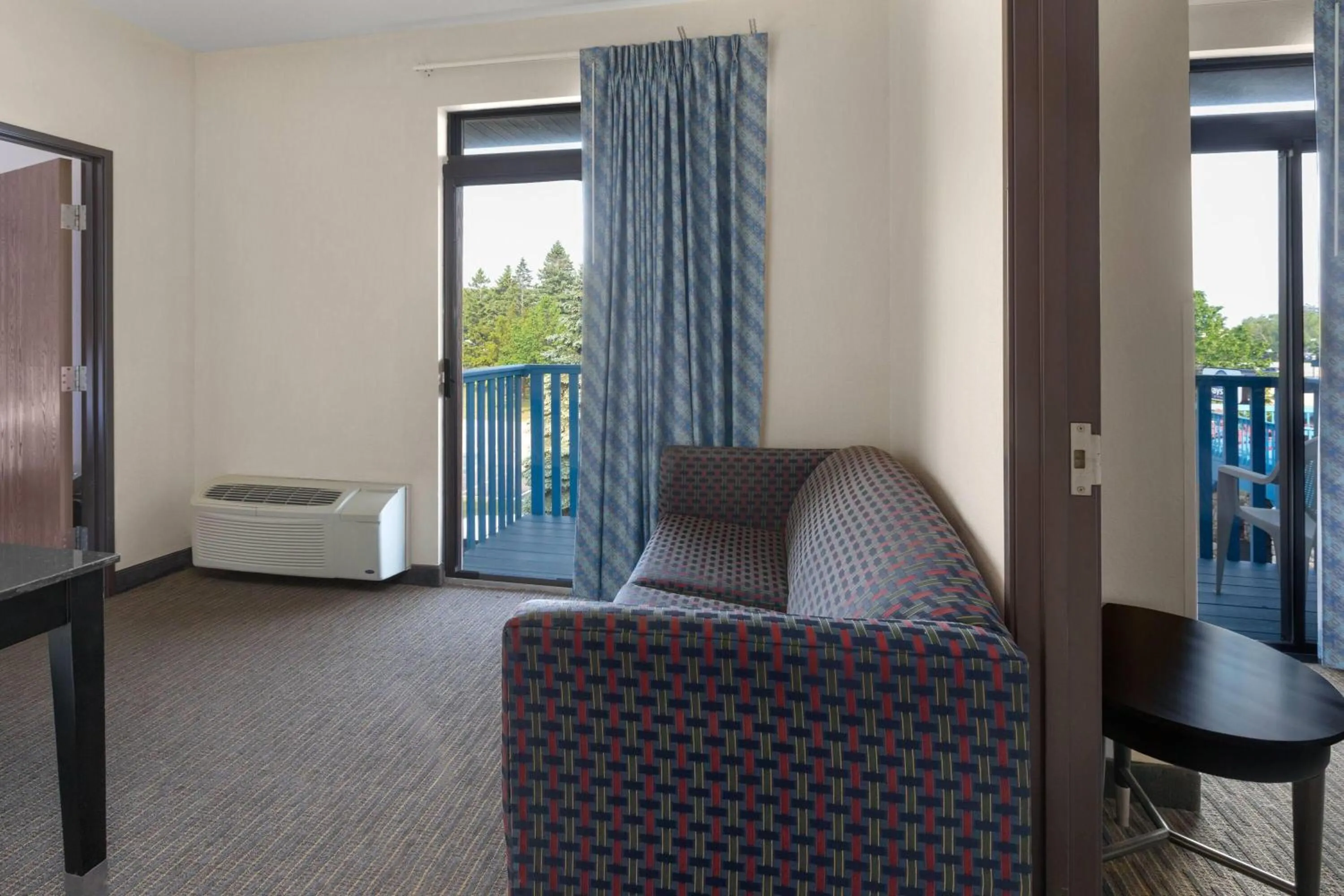 Two-Bedroom Suite with Four Queen Beds and Balcony - Non-Smoking in Days Inn by Wyndham Mackinaw City - Bridgeview Area