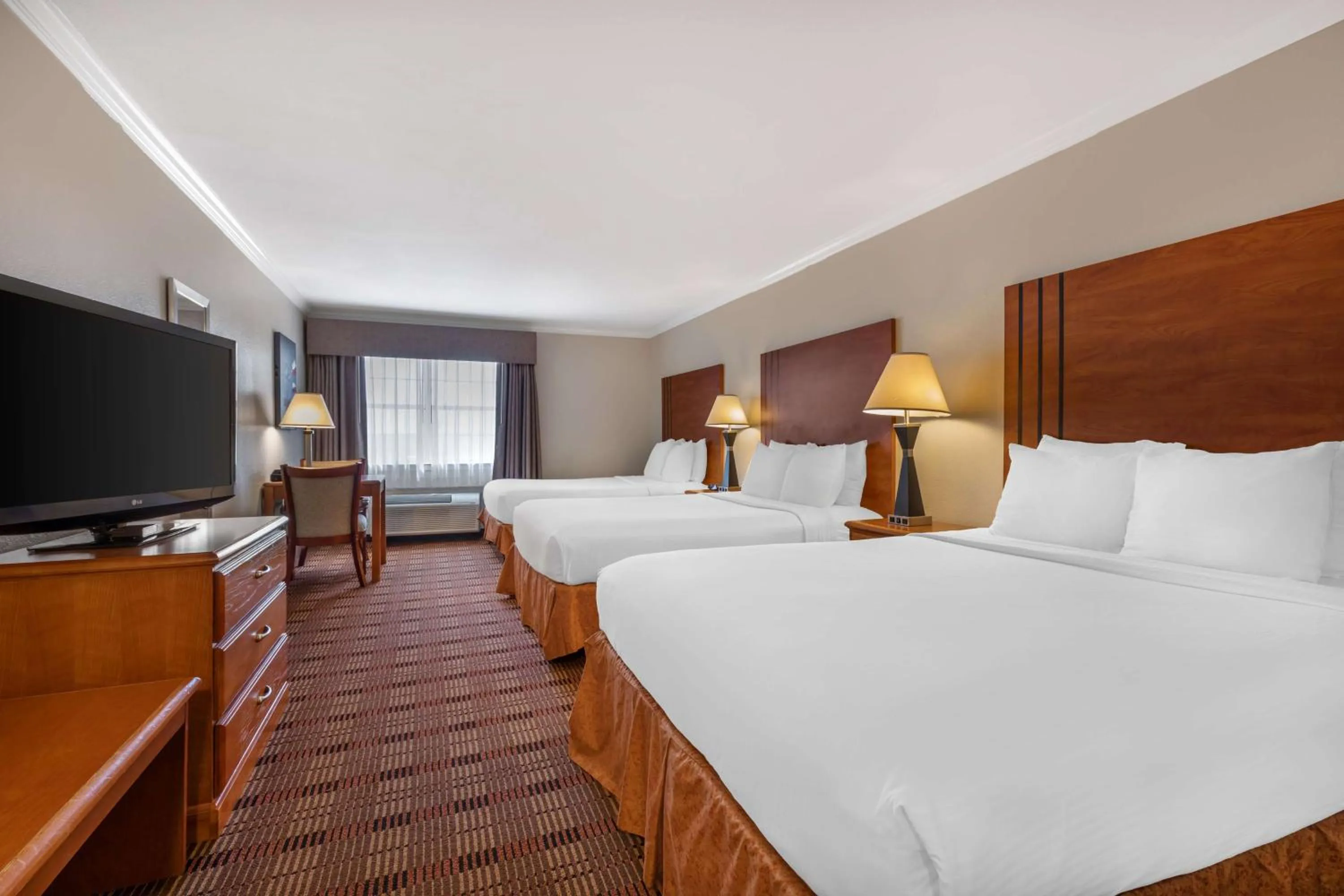 Queen Room with Three Queen Beds - Non-smoking in Best Western Club House Inn & Suites