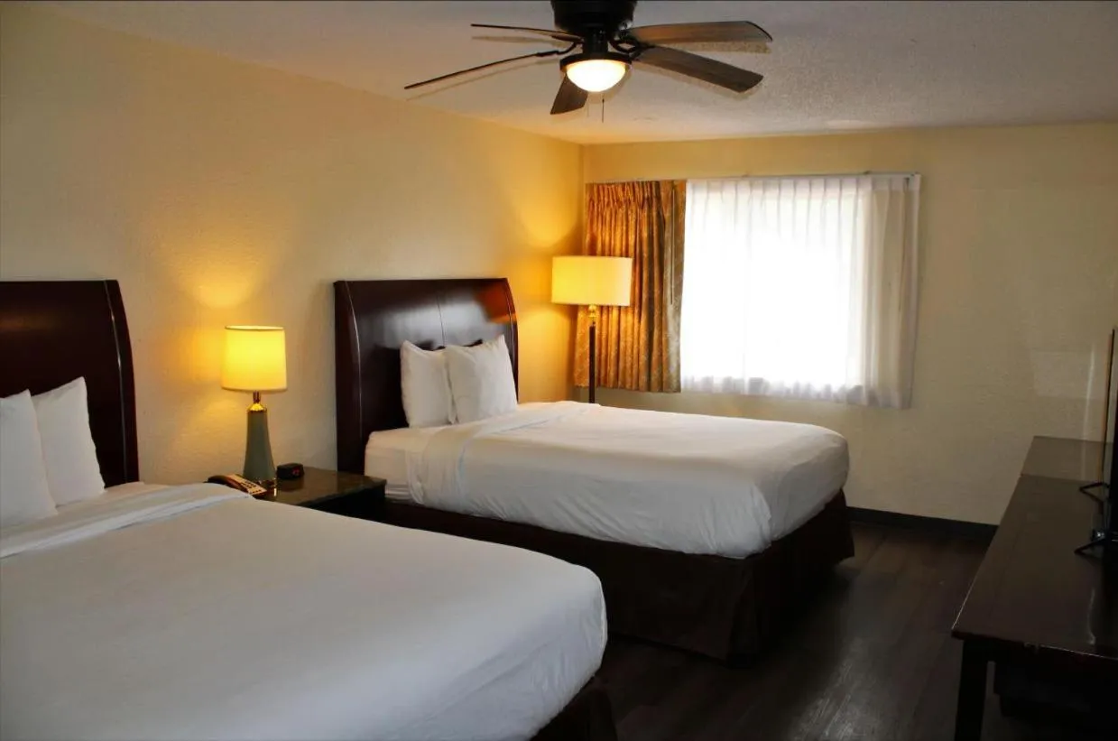 Suite with Three Queen Beds - Non-Smoking in Days Inn & Suites by Wyndham Marshall